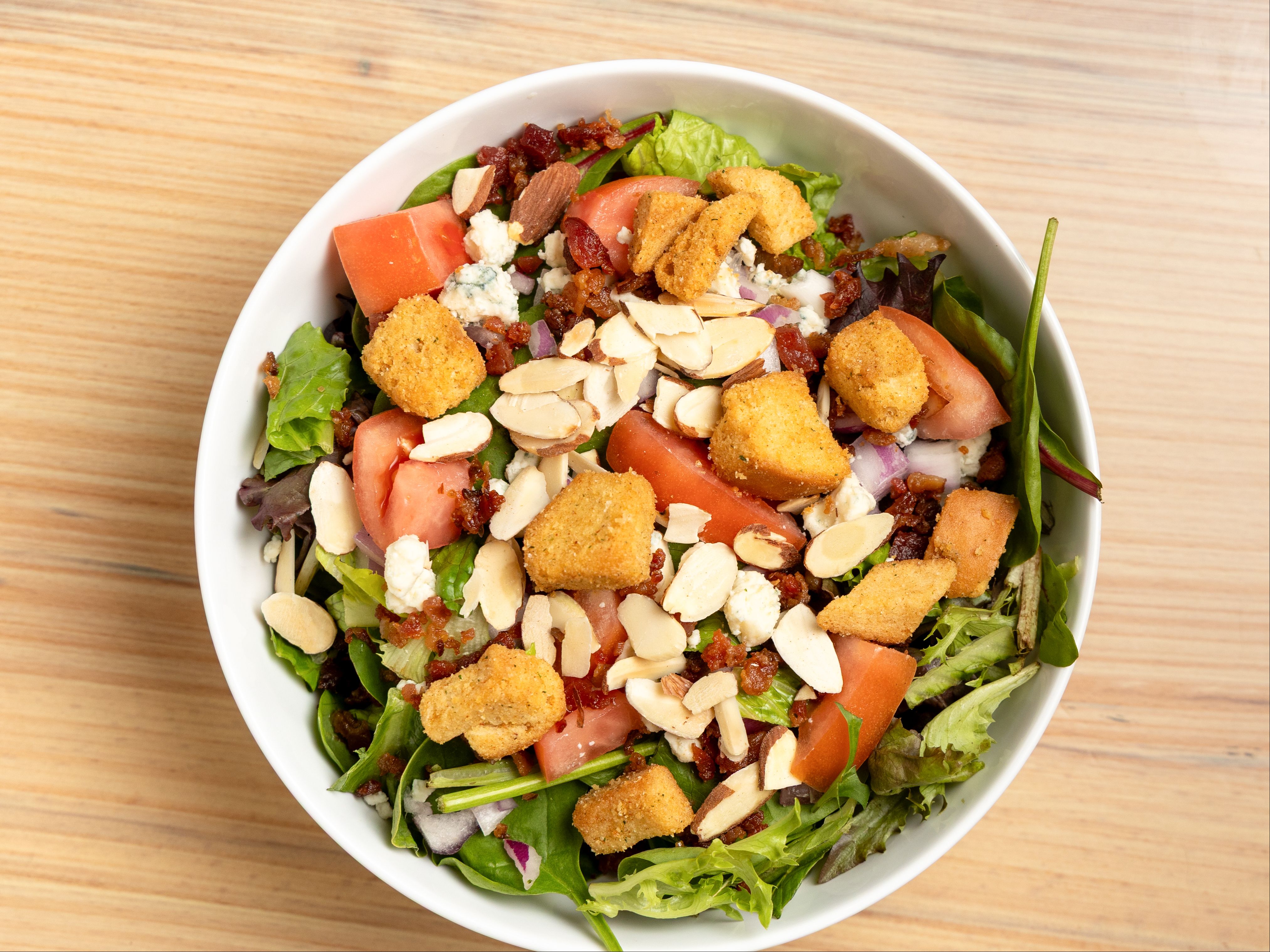 Whaz Up - Fresh Salad Blend, Red Onions, Tomatoes, Blu Cheese Crumbles, Almonds, Croutons, Bacon, Wasabi Honey Mustard