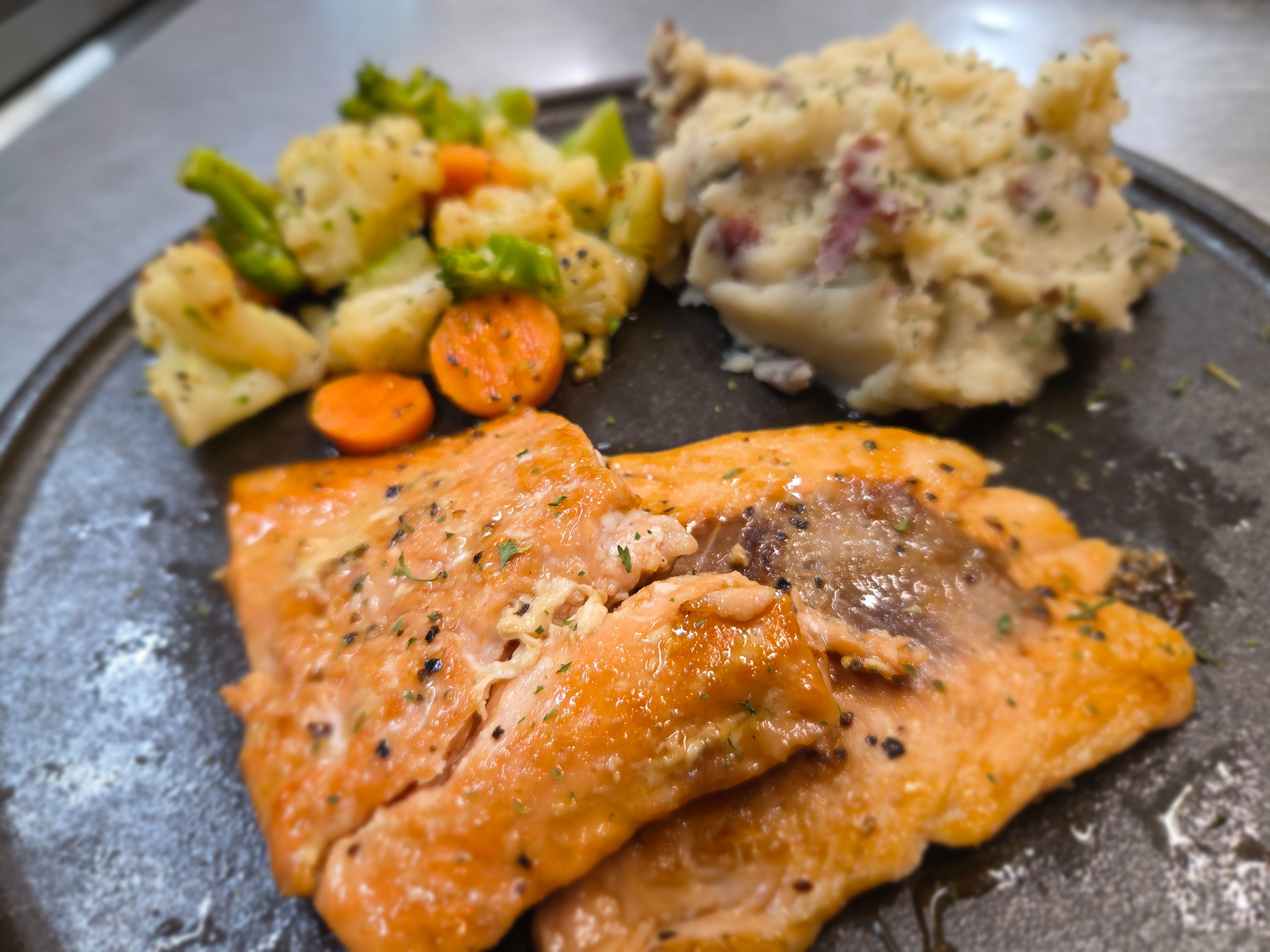 8oz Maple Bourbon Glazed Salmon w/ potato & Veg.