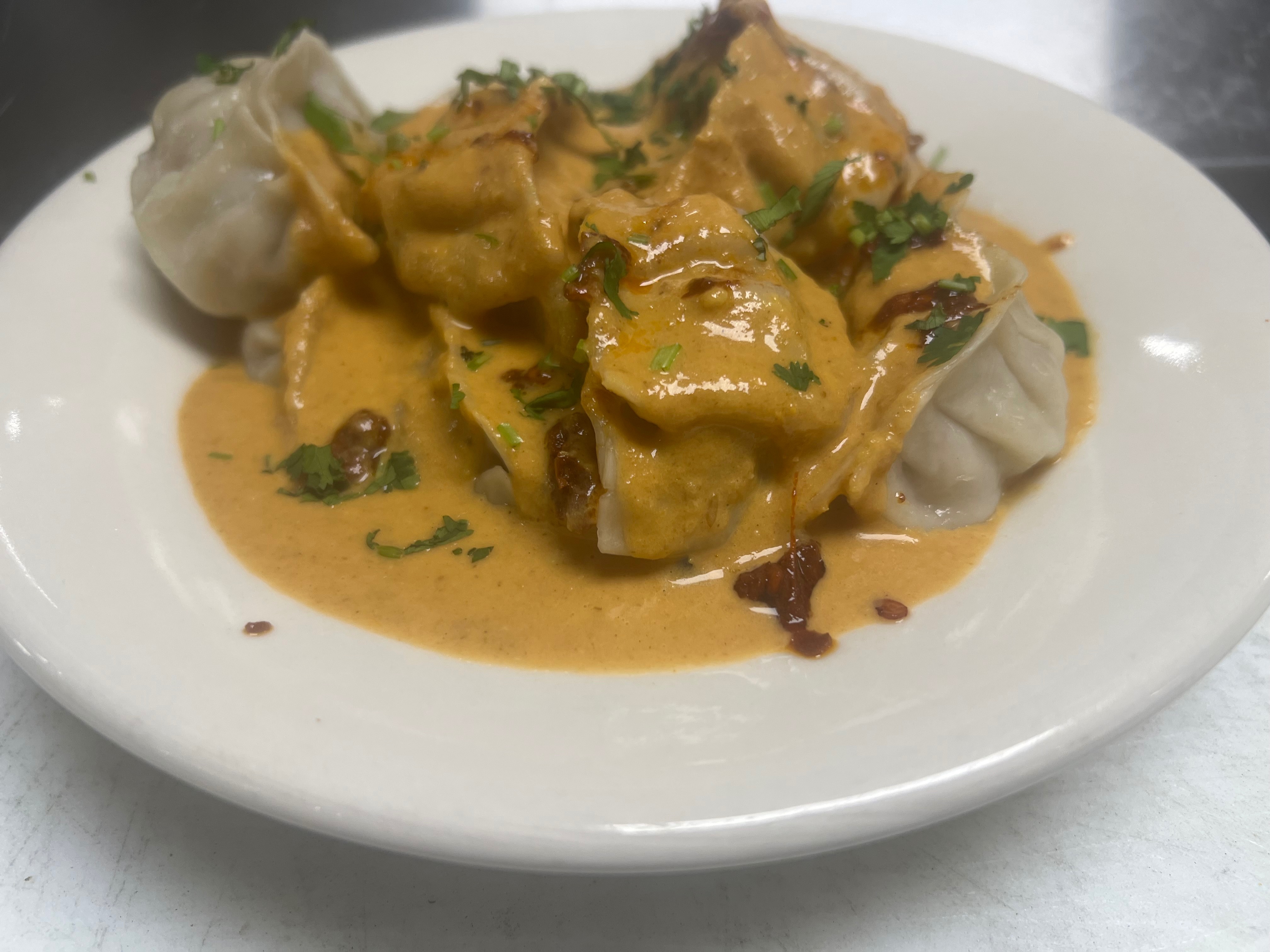 Chicken Jhol Momo (Contain nuts& Sesame Seed).