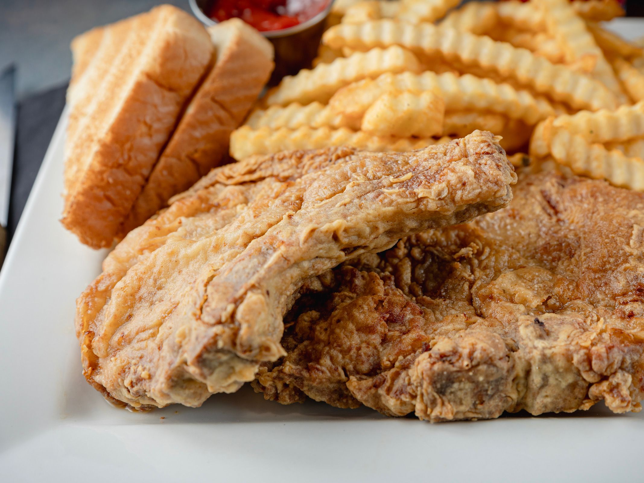 KAJUN BONE-IN PORK DINNER