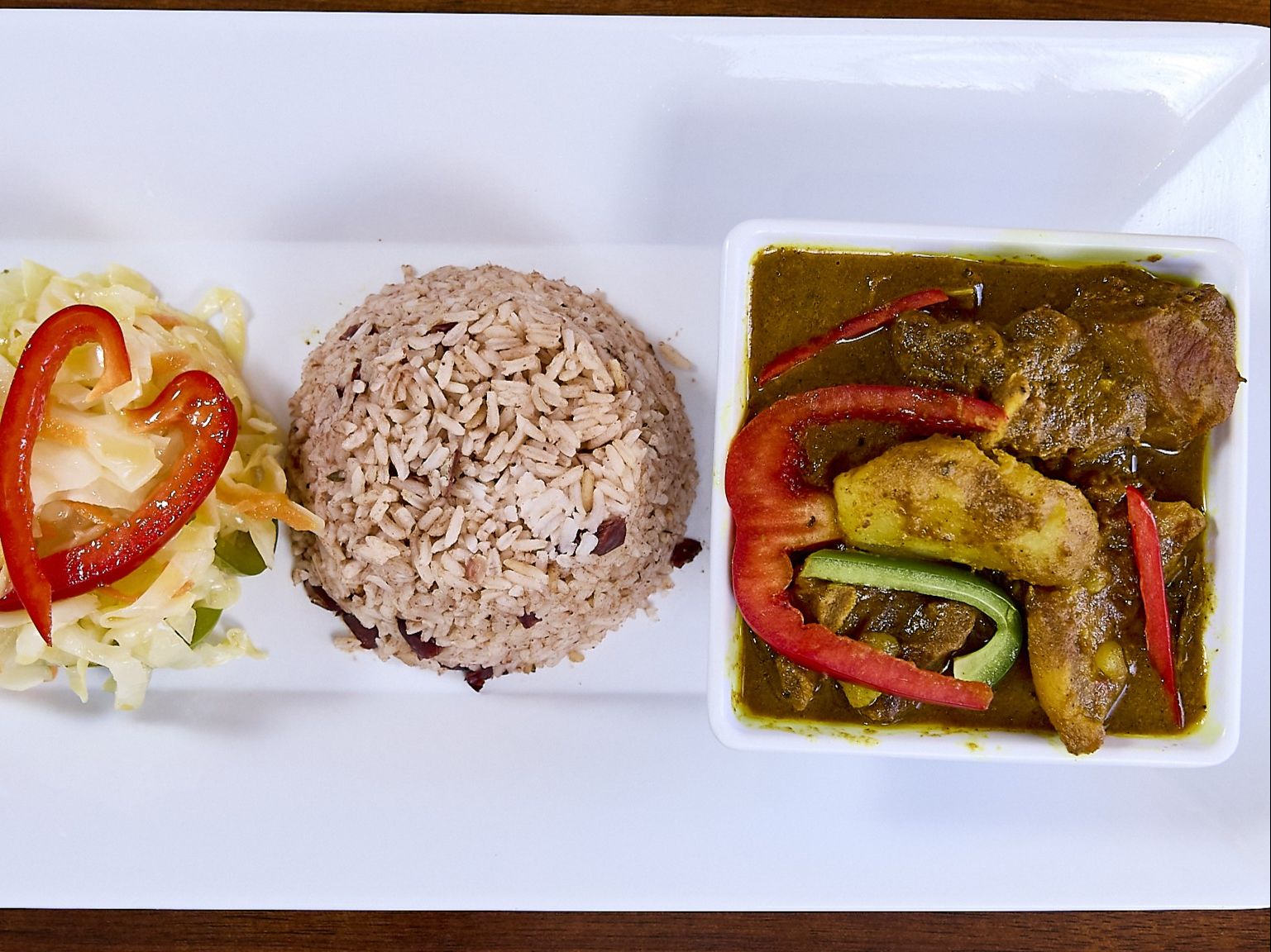 CURRY GOAT (E).