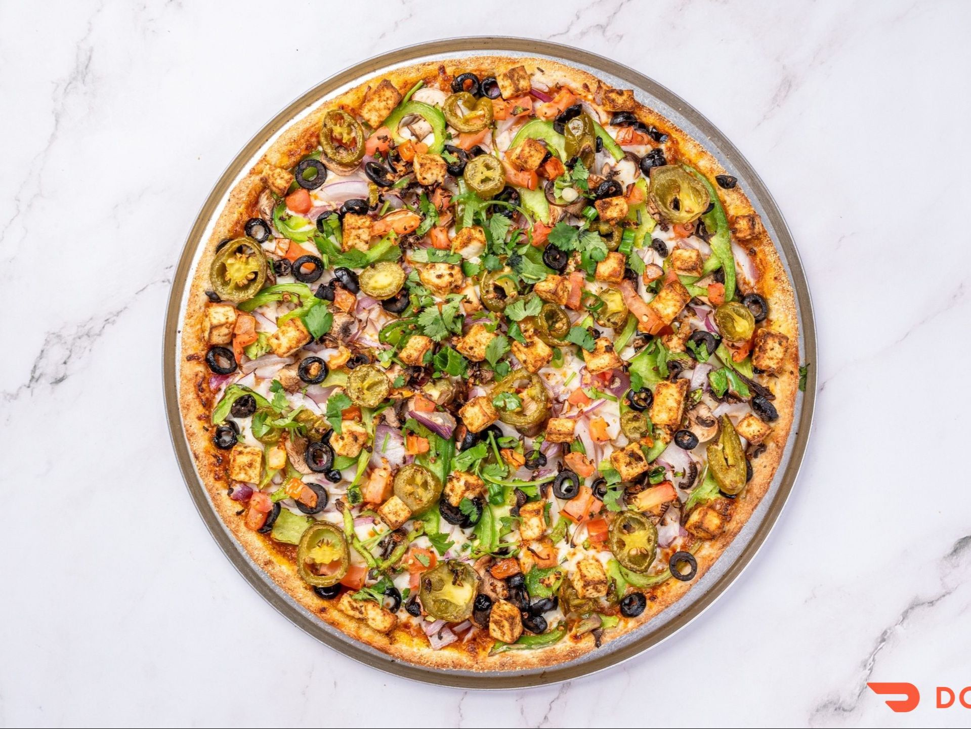 Desi Veggie Deluxe Pizza.