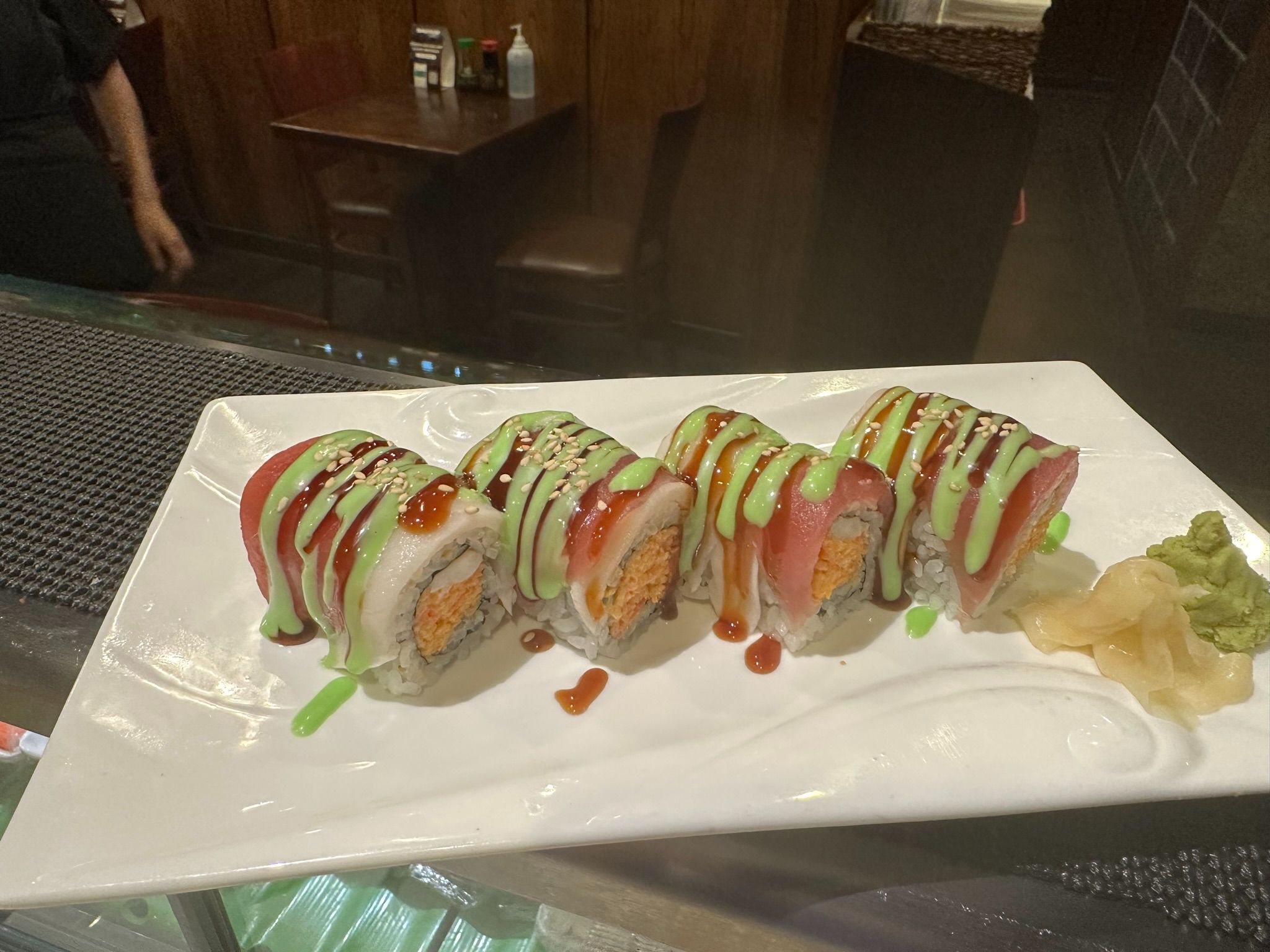 Candy Cane Roll - Sushi shrimp, crab salad and crunchy inside, red tuna and white tuna on top with special sauce.
