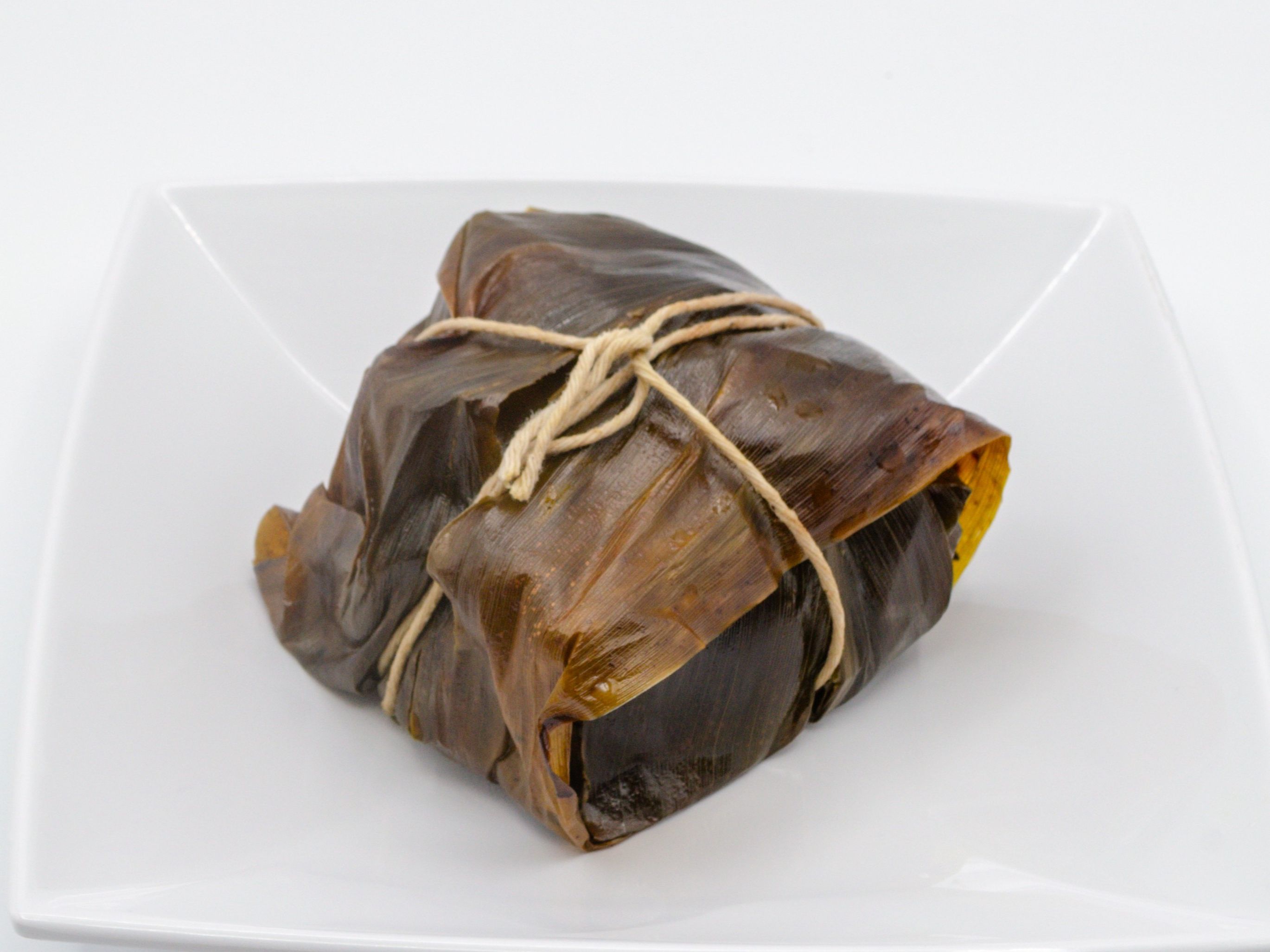 Lau Lau - Chicken Only from Yama's Fish Market — A lighter version of our lau lau — chicken with luʻau leaf, hand-wrapped and steamed the same traditional way.