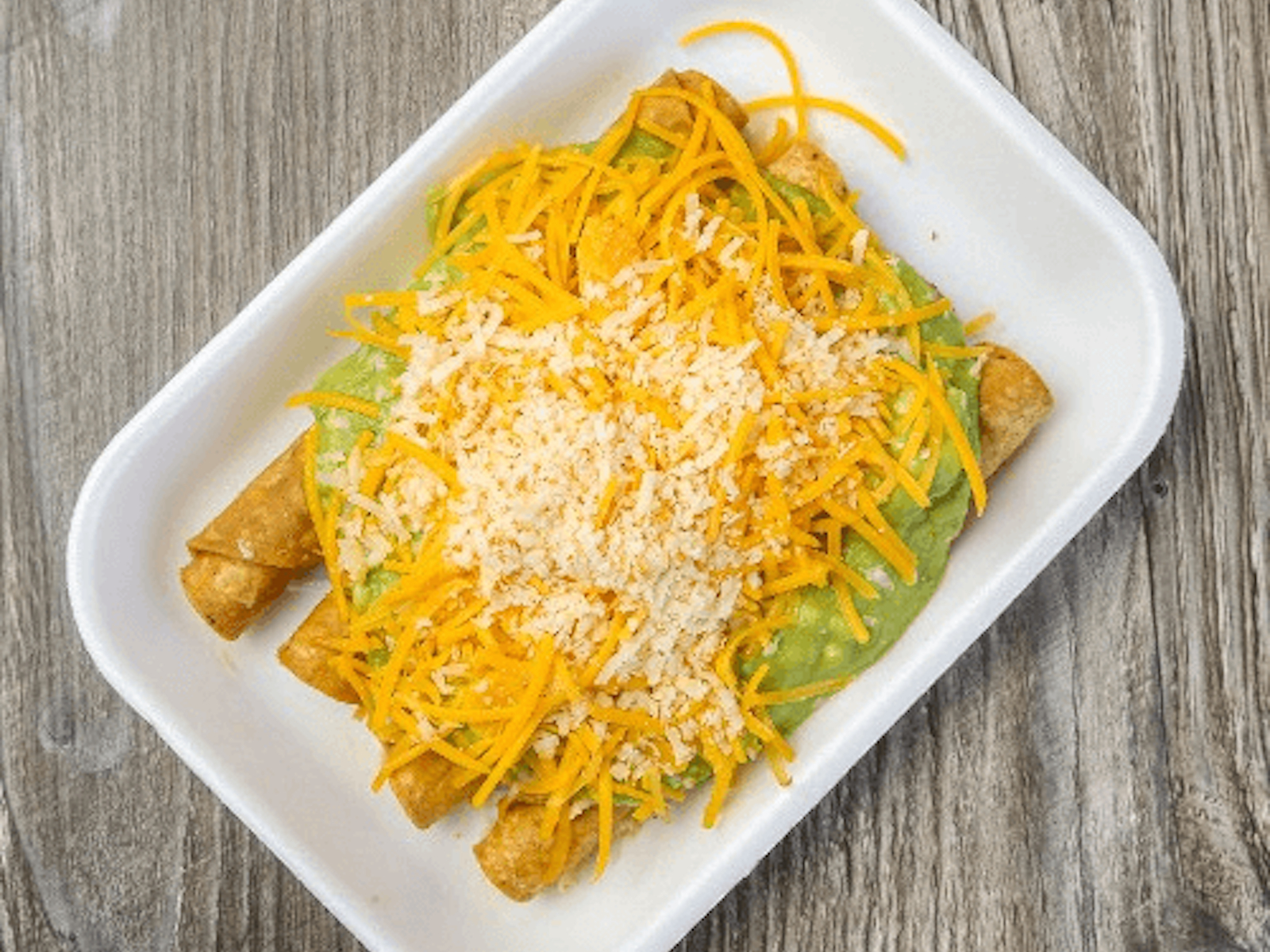 CHICKEN 5 Rolled Tacos Guacamole.