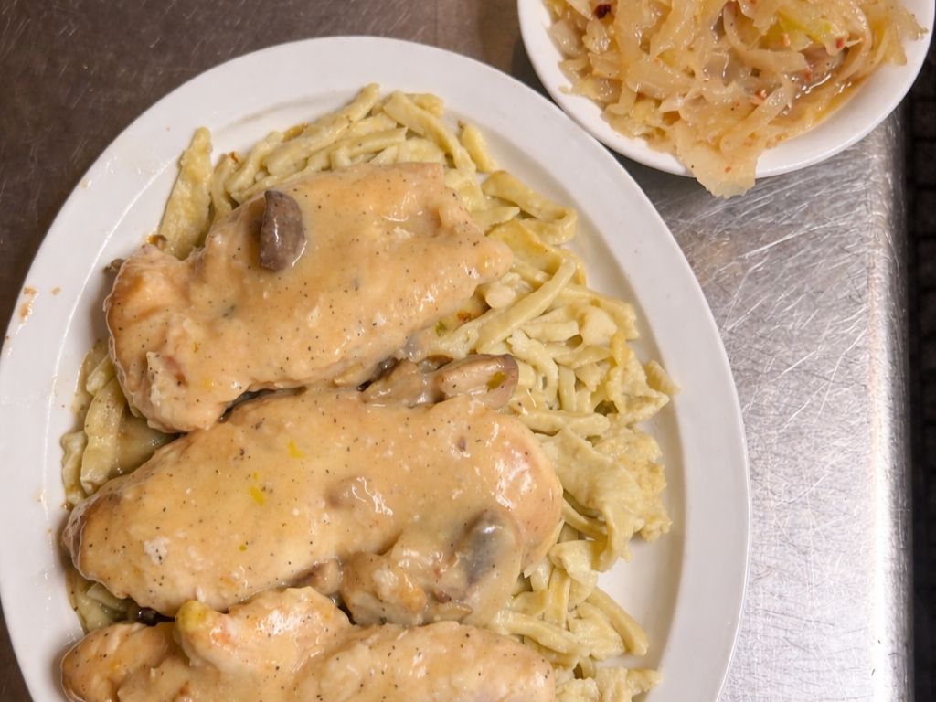 Marinated Chicken Over Kluski Noodles.