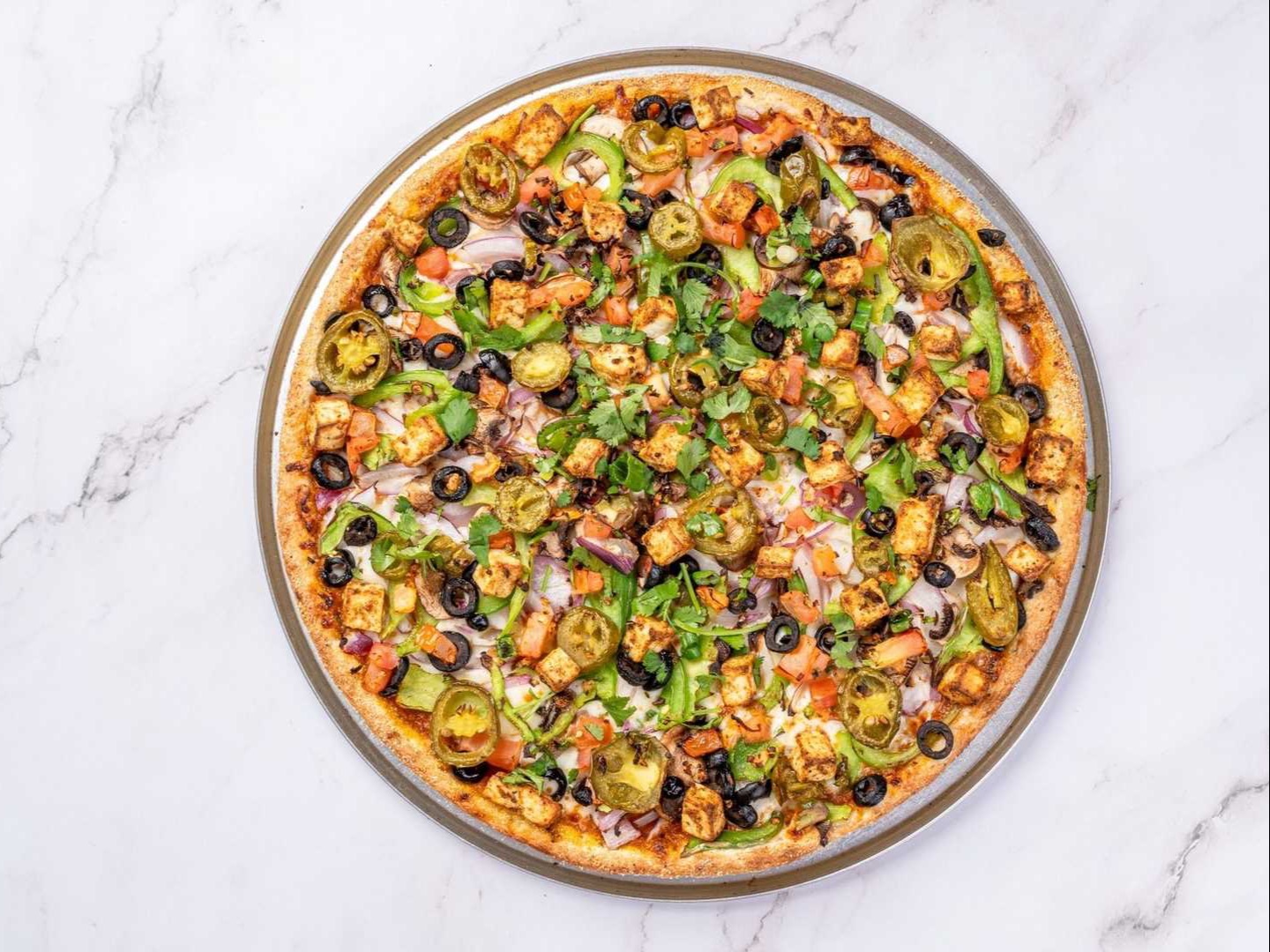 Desi Veggie Deluxe Pizza