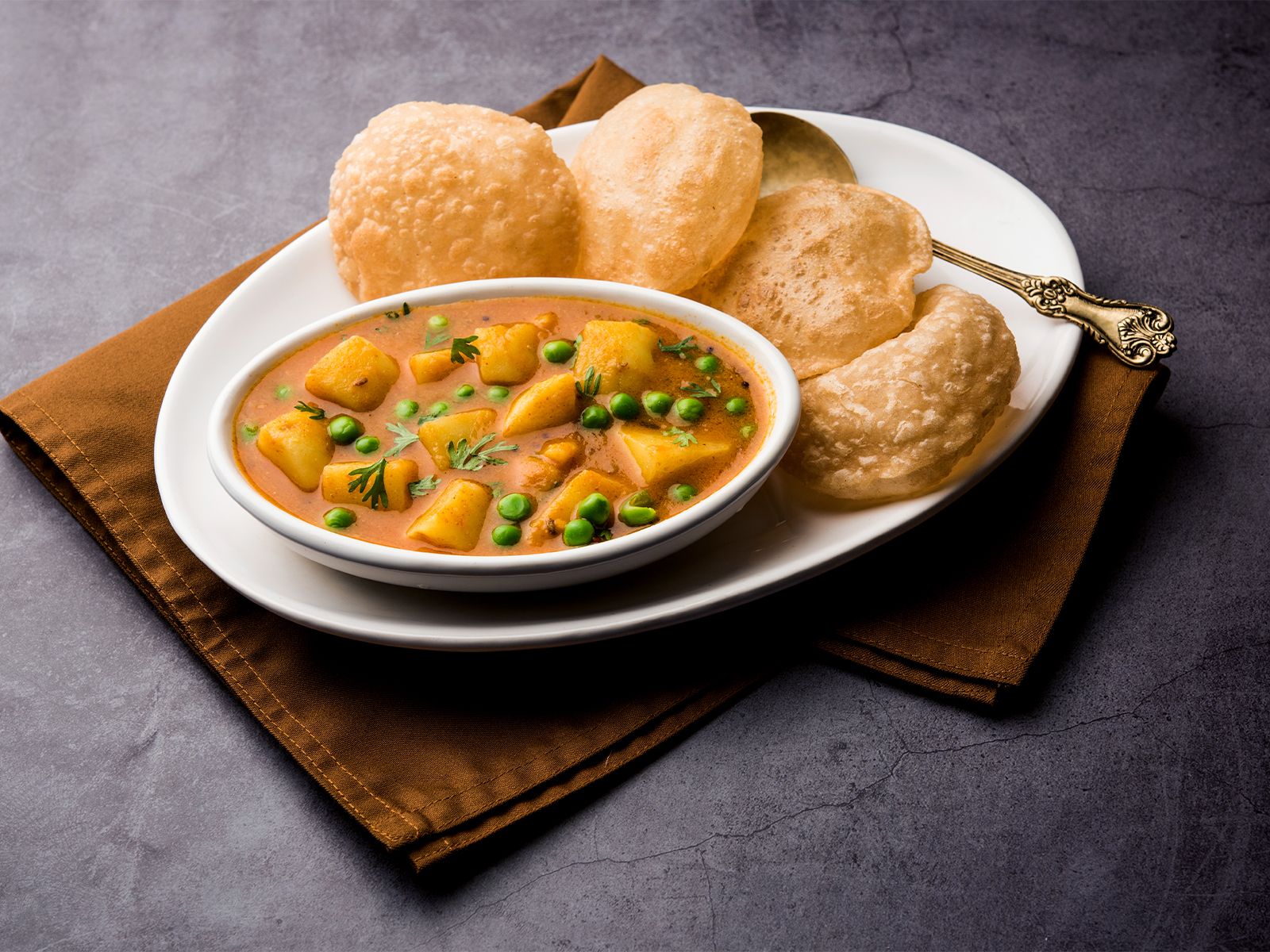 ALOO BHAJI W/MASALA PURI.