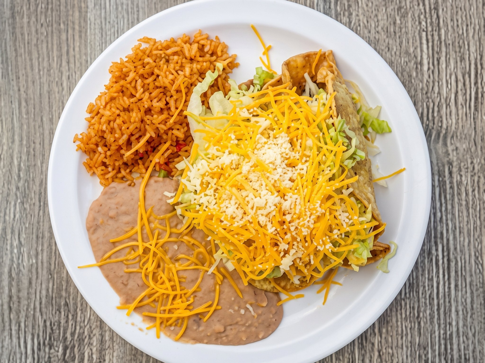 Chicken Crispy Taco, Lettuce, Cheddar, Cotija