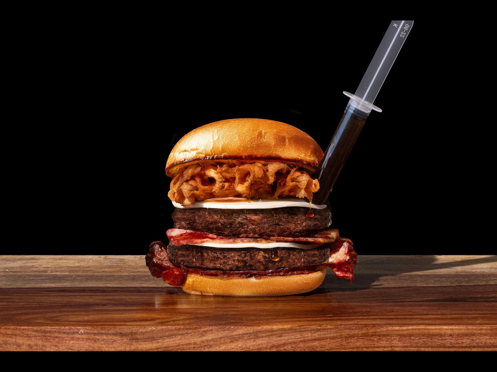 Maple Bacon Burger - 2 patties, provolone cheese, crispy bacon, grilled bacon, beef bacon & maple syring.