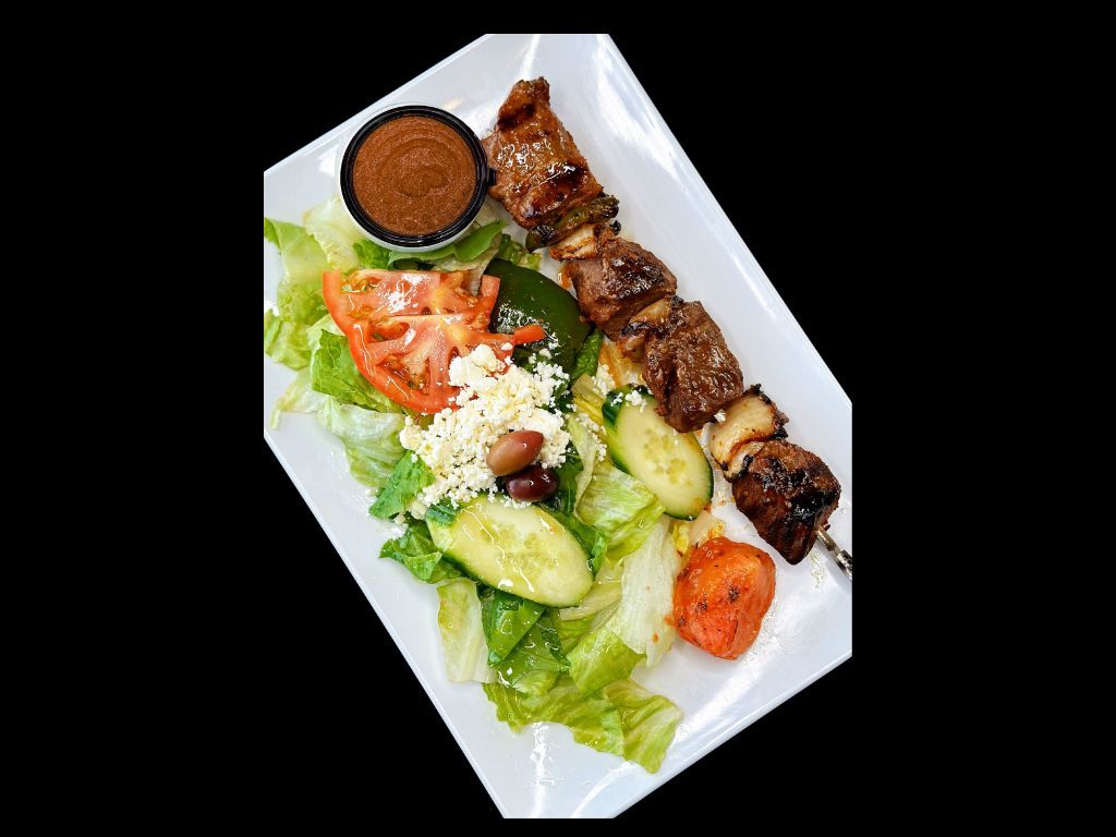 Steak Kebab (1 Skewer) Over Salad.