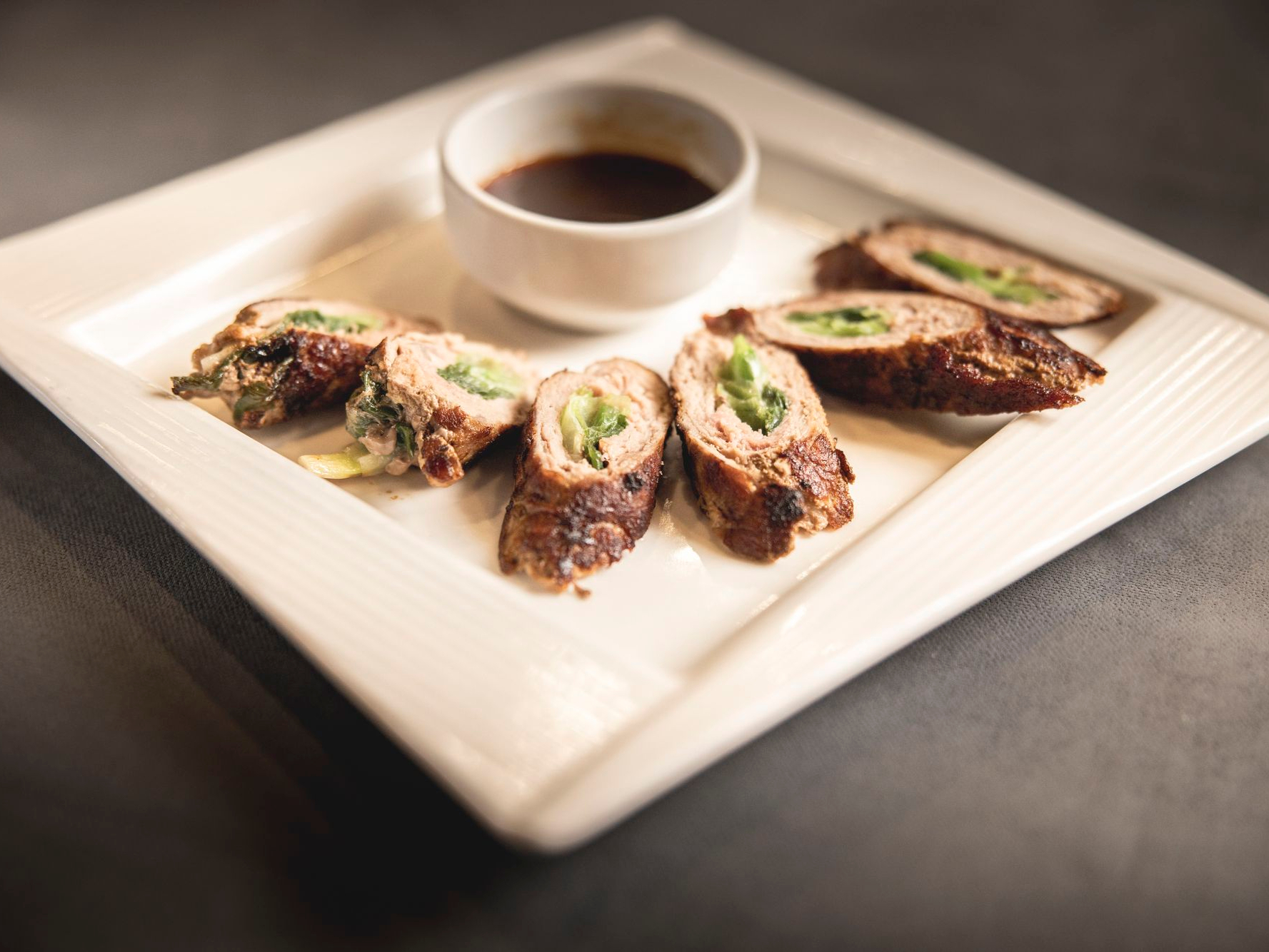 Beef Negimaki - Thinly sliced steak rolled with scallion.