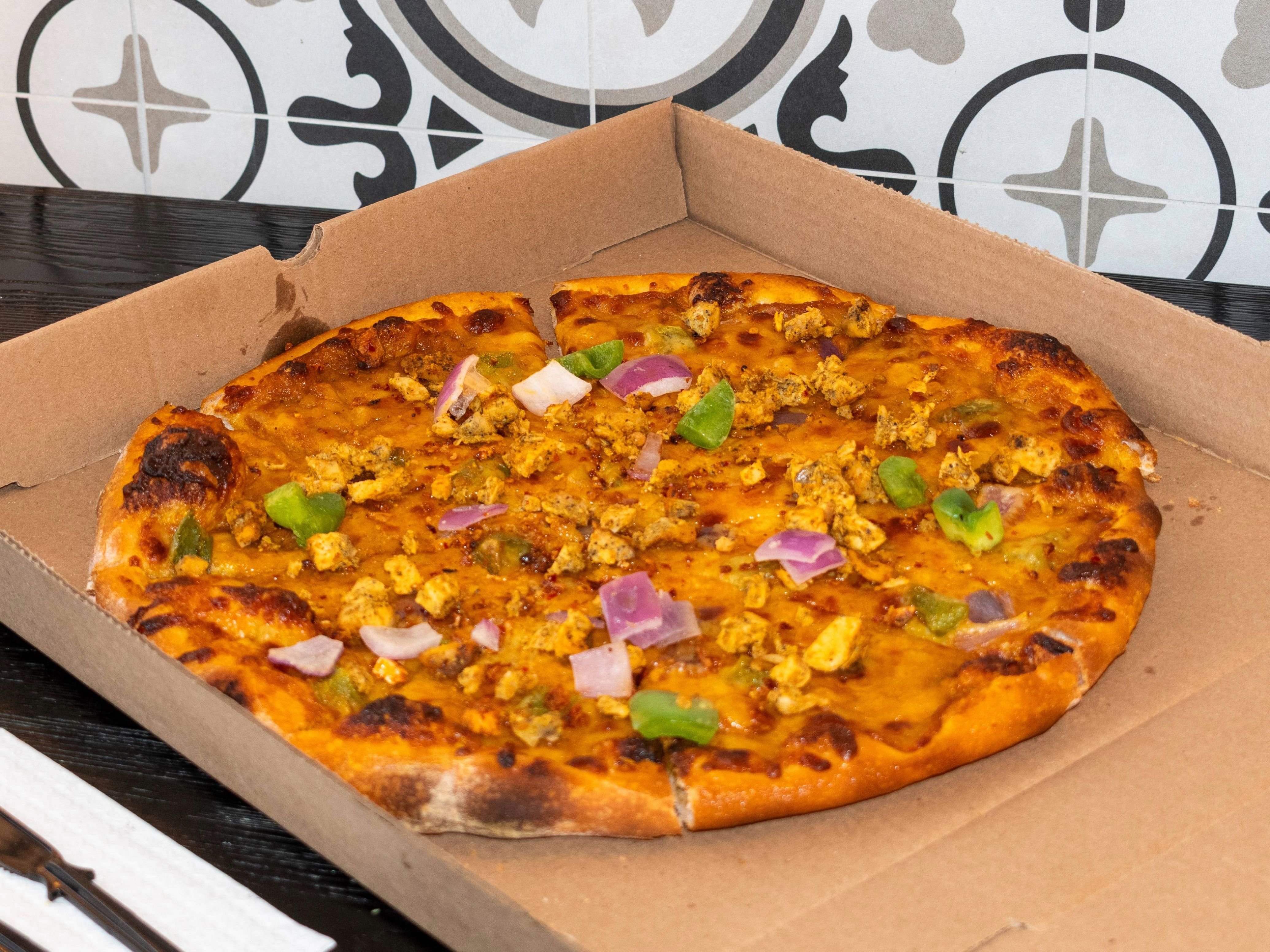 Achari Chicken Pizza.