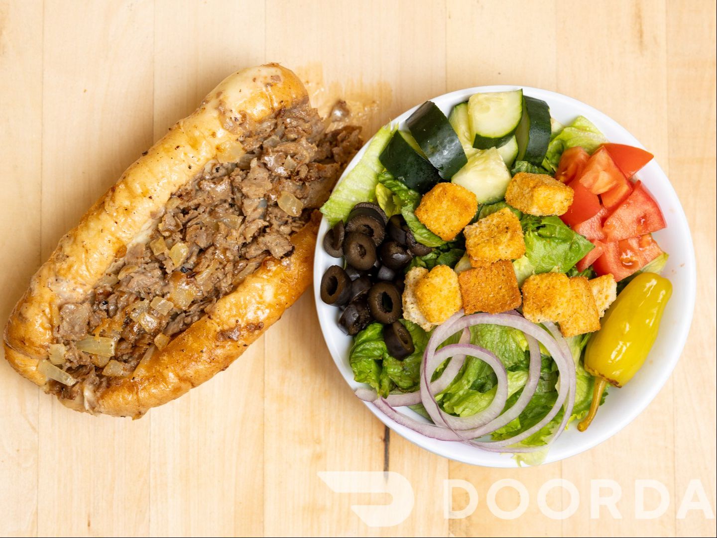 $12 Famous Philly Cheesesteak W/Salad.