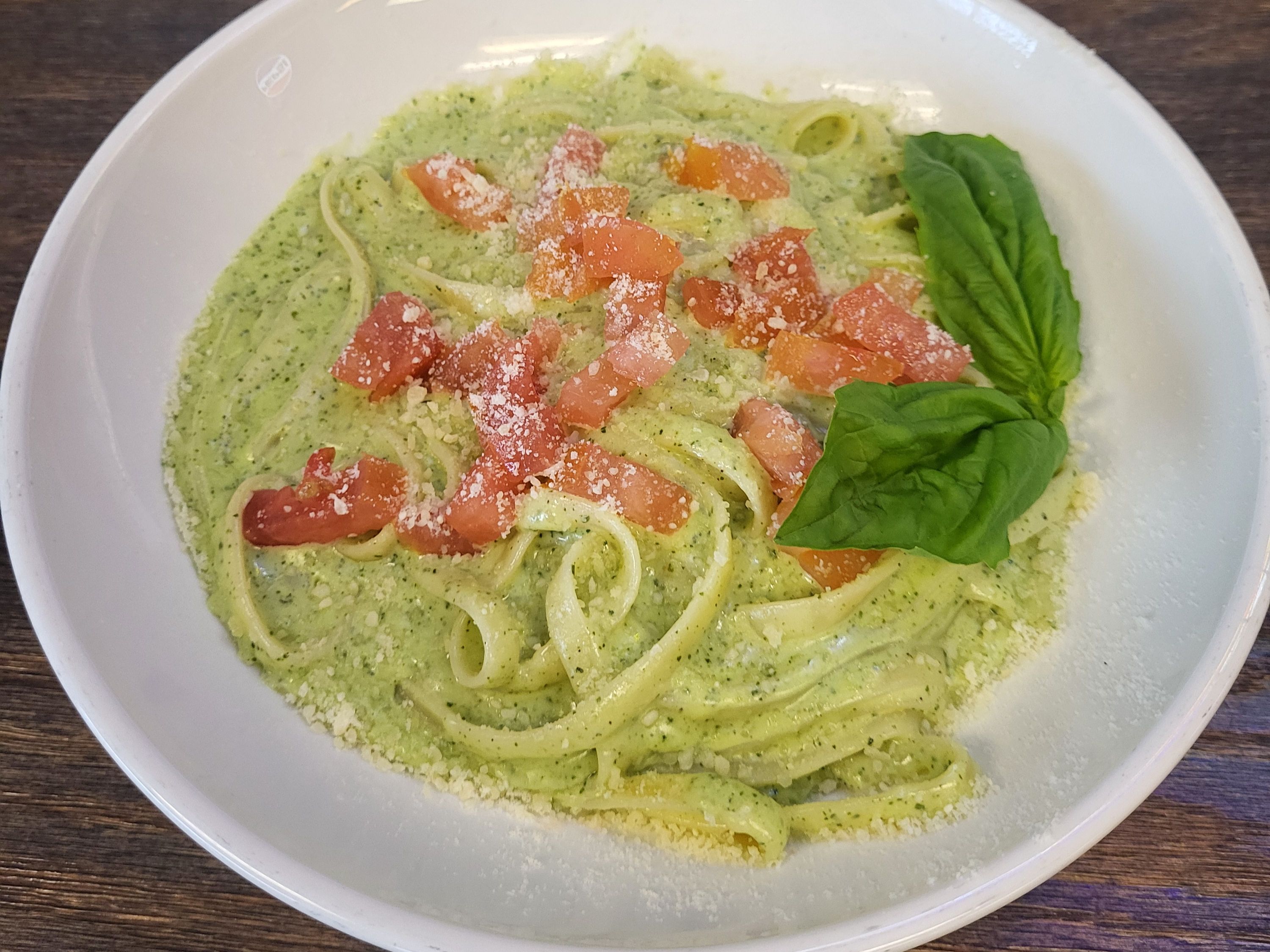 Creamy Pesto Alfredo Topped With Dice Tomato