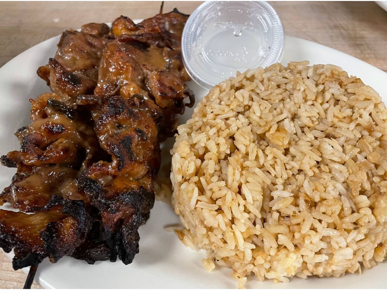 Pork BBQ W/ Garlic Rice *Contains Peanut Sauce* (4 Sticks 4")