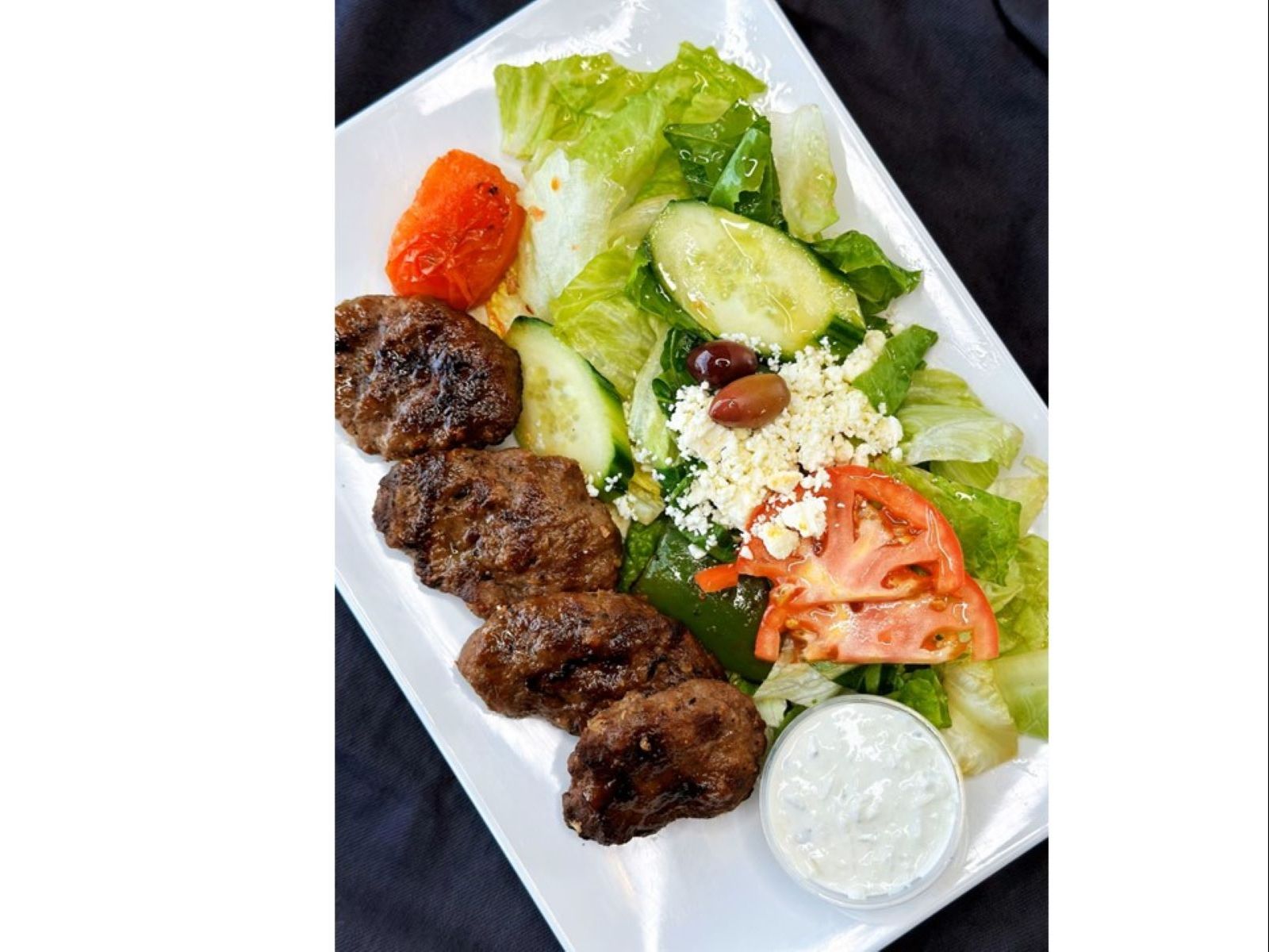Kofte Kebab (4 Pieces)  Over Salad