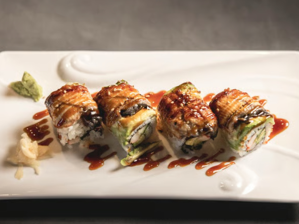 SR11. Dragon Roll - Crabstick, avocado, cucumber with tuna, salmon, shrimp, white fish & masago outside.