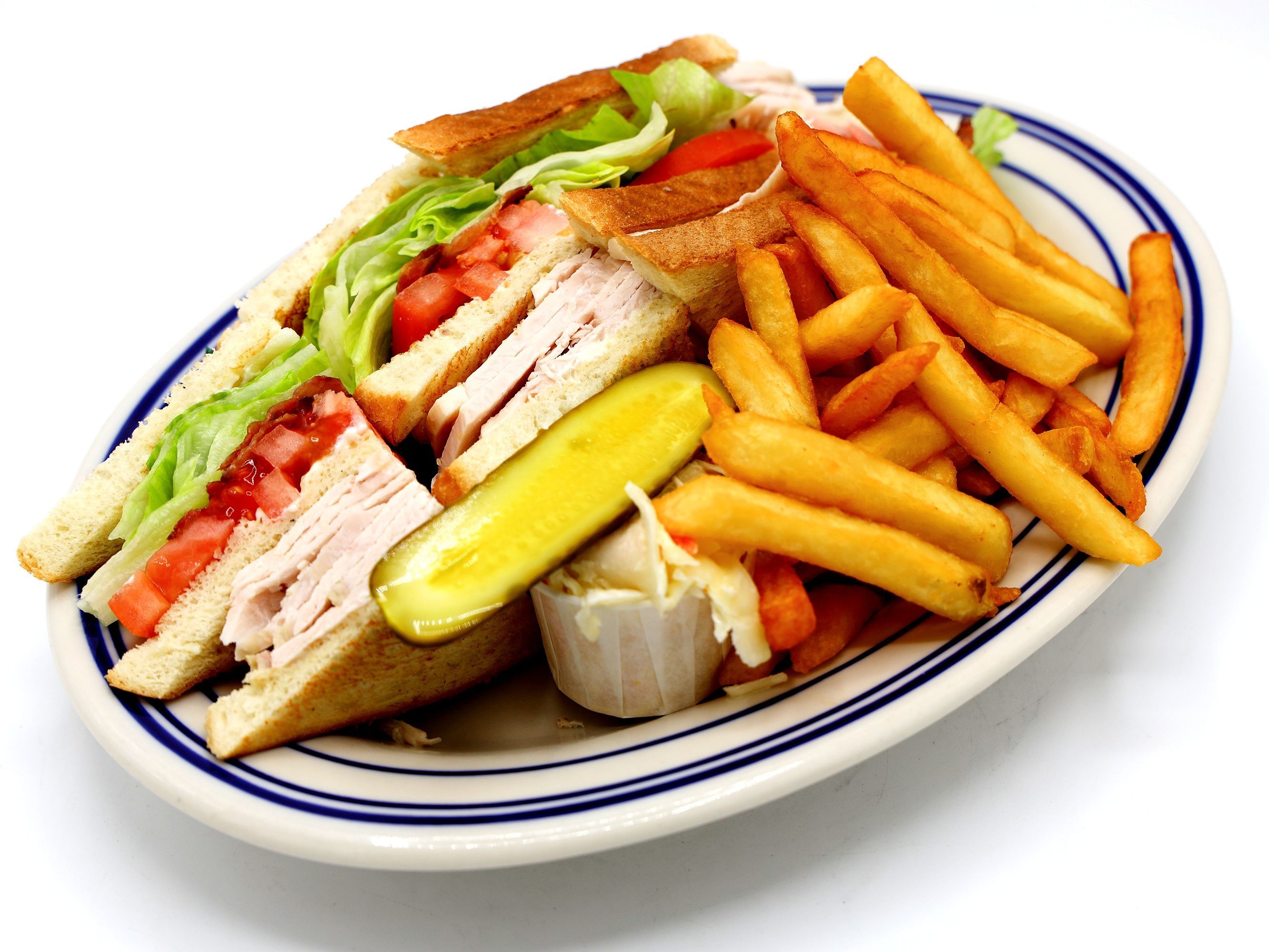 Club sandwich with fries.