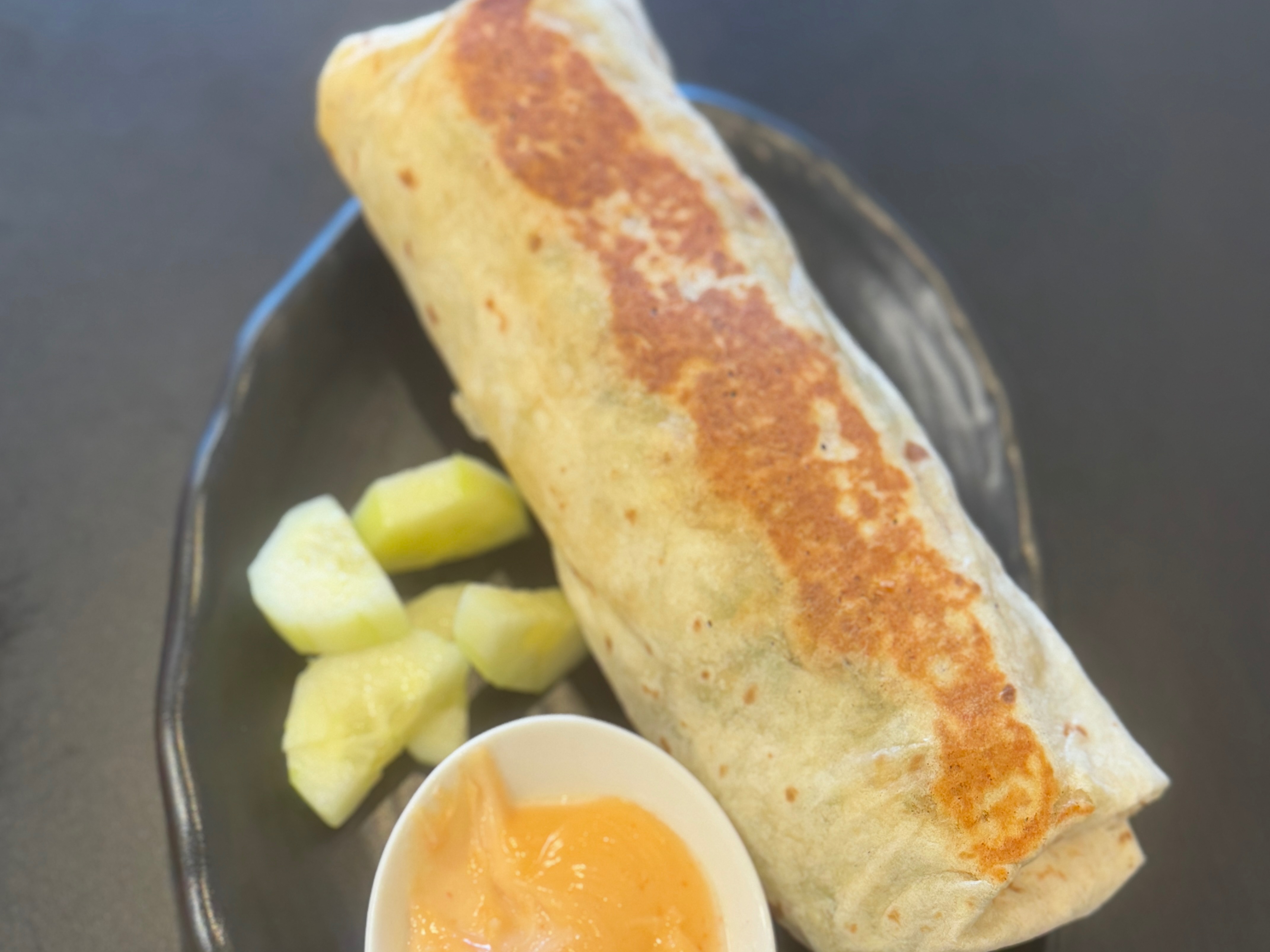 Sharjah Vegetarian Shawarma ( Grilled Panner,bread,lettuce,cucumber,onion,sharjah Sauce ).