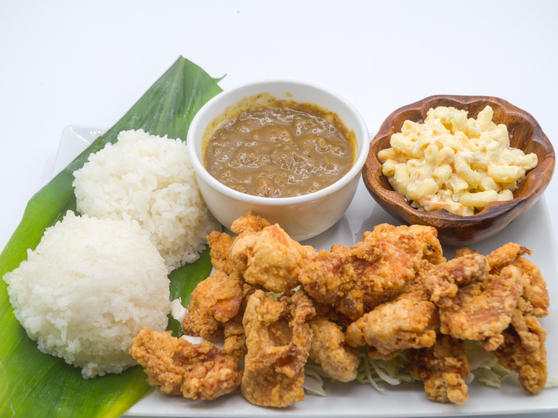 #25 Chicken Karaage Curry from Yama's Fish Market — Japanese-style marinated chicken thighs (soy, garlic, ginger), fried crisp and served with our hearty curry sauce. Served with white rice and mac salad.