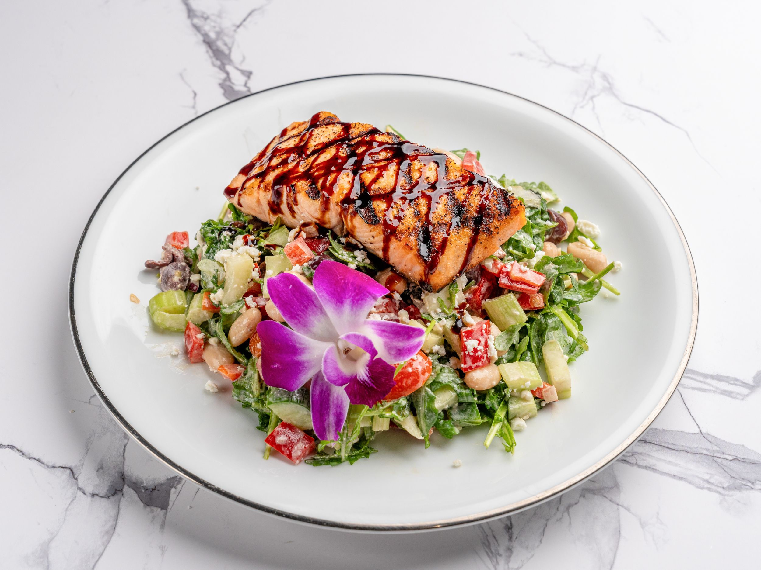 Grilled Salmon over a Mediterranean Salad