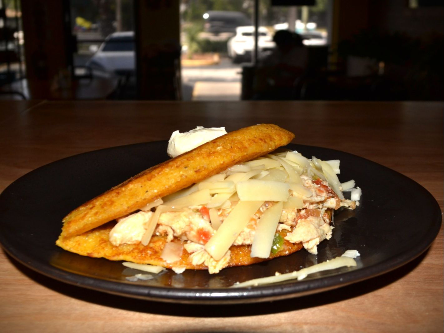 Sweet Corn Bread / Cachapa Shredded Chicken and Striped Cheese / Pollo Mechado y Queso Rayado.