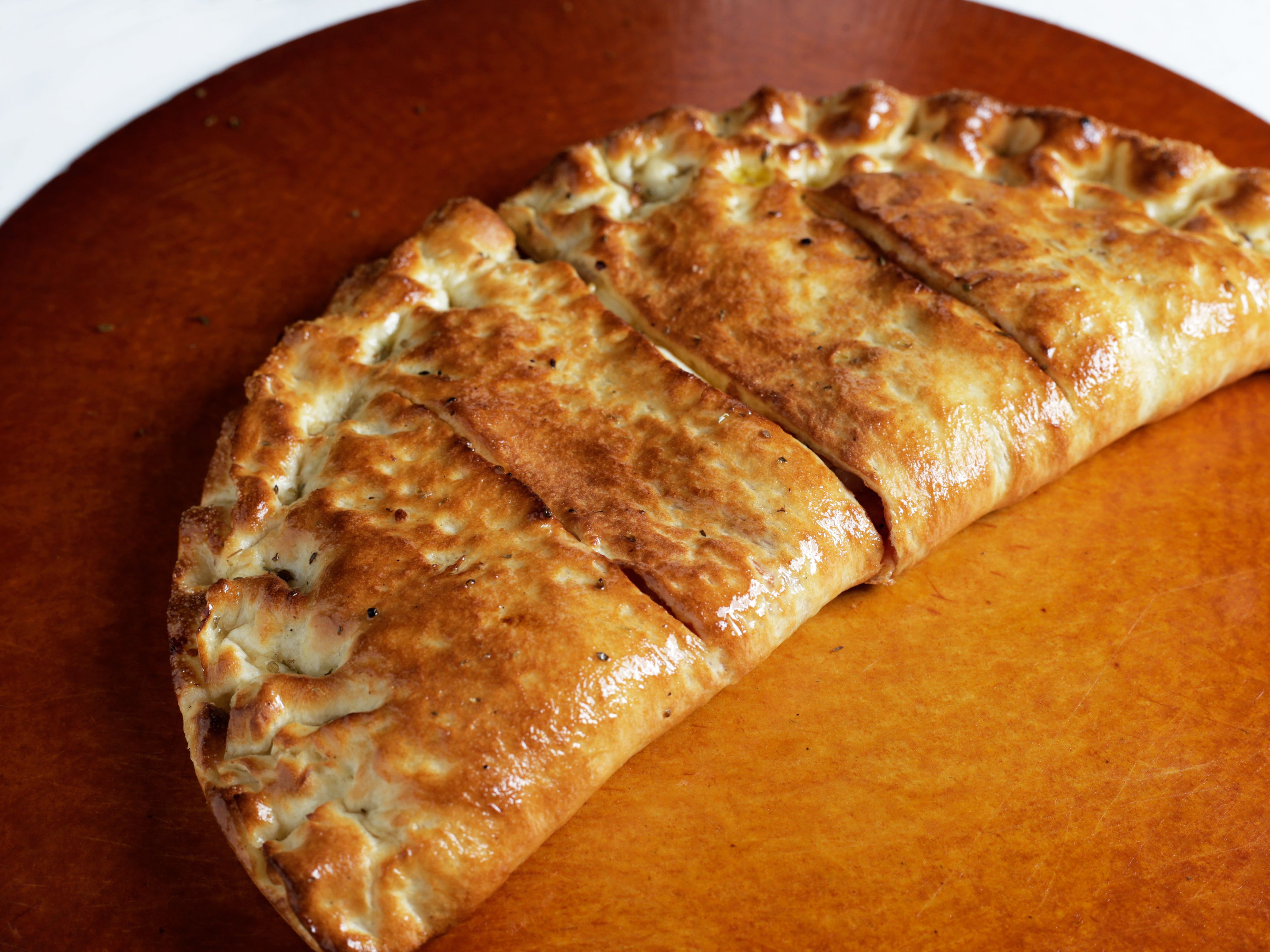 Halal Chicken & Cheese Calzone.