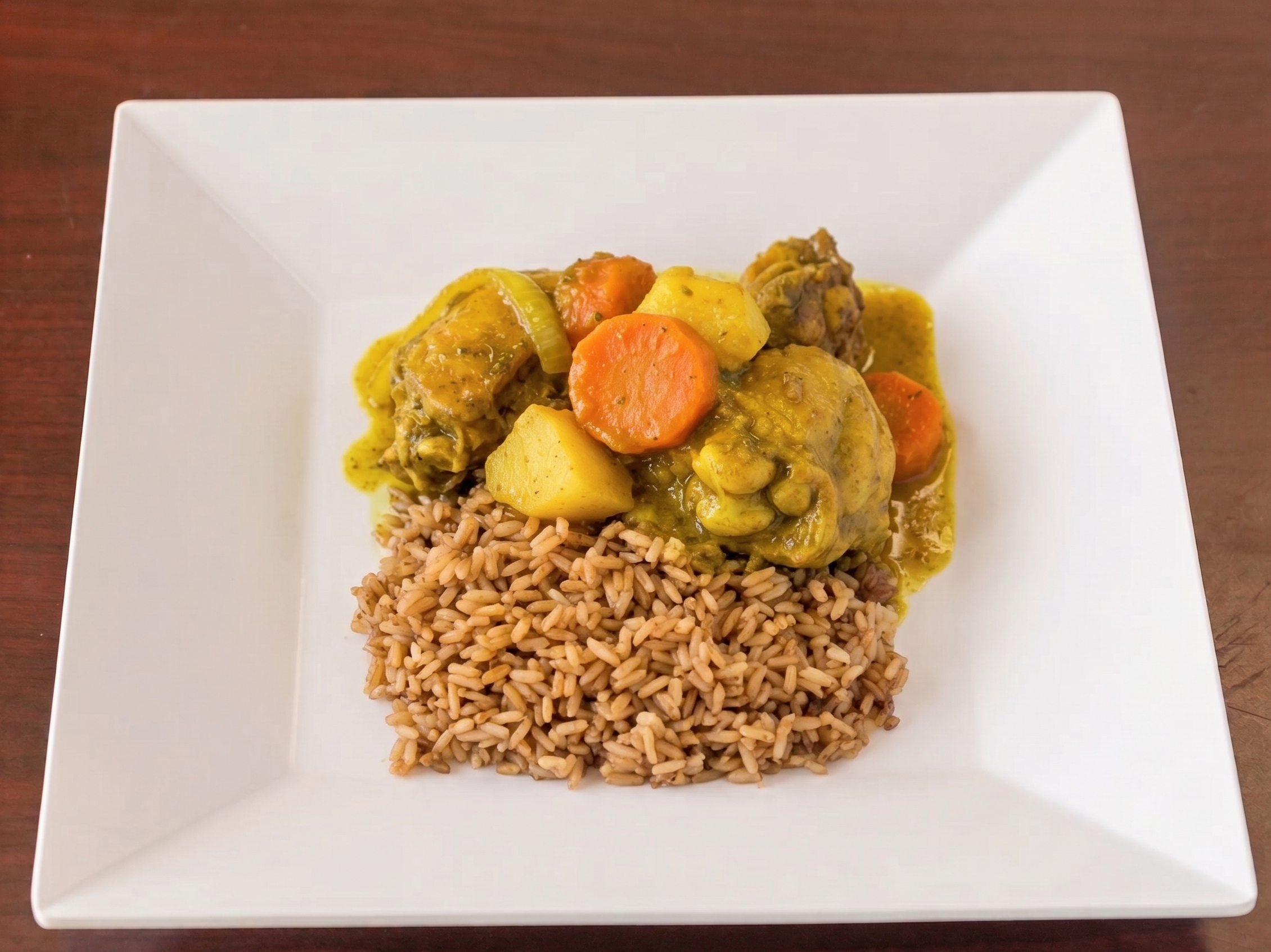 Curry Chicken, Steamed Cabbage, Rice and Peas.