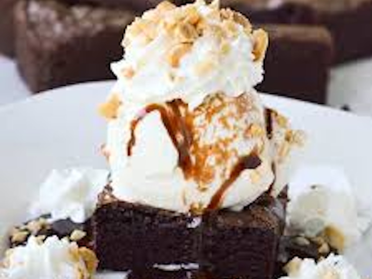CHOCOLATE BROWNIE WITH ICE CREAM.