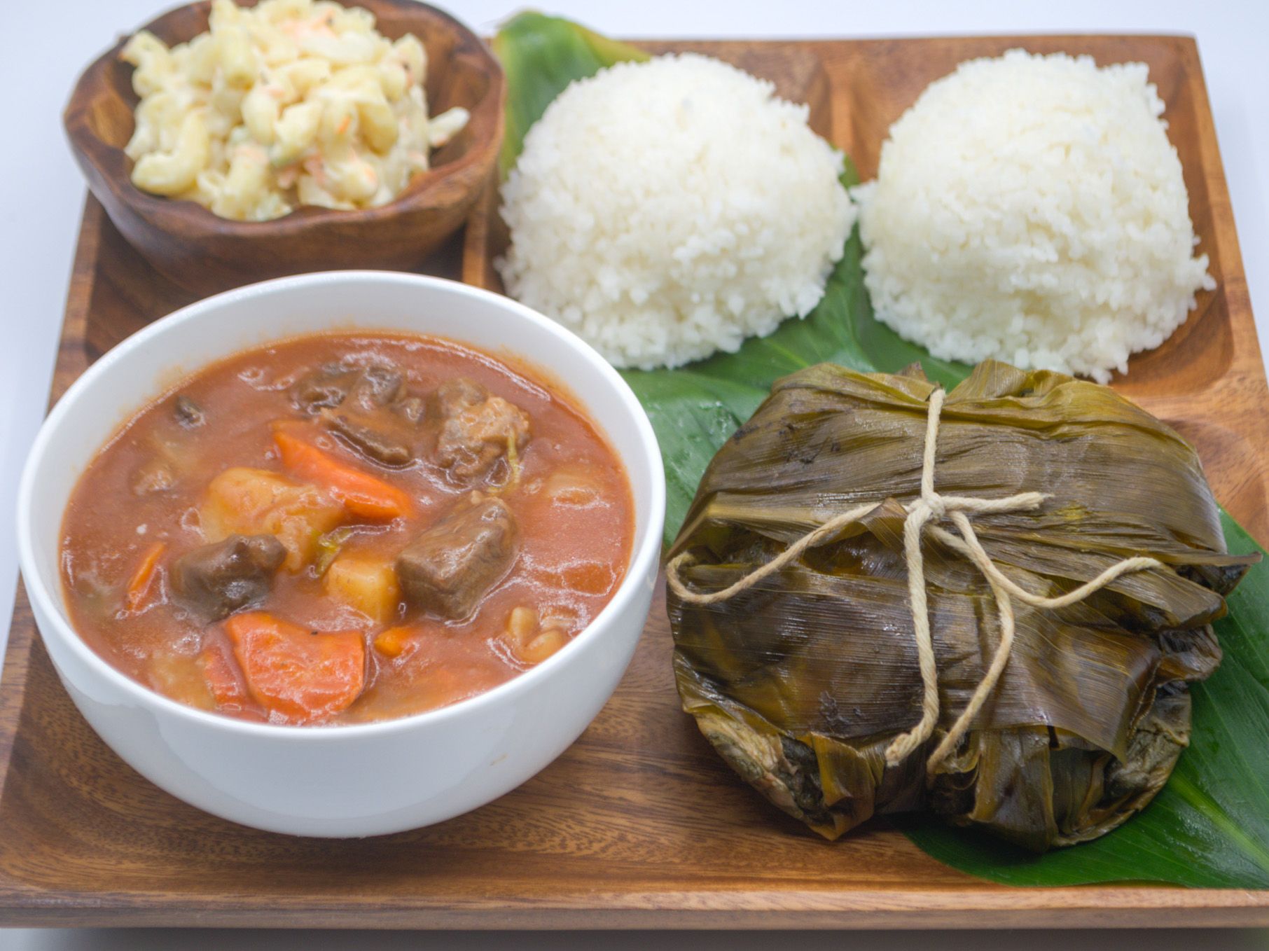 #8 Lau Lau, Beef Stew & Mac Salad from Yama's Fish Market — Tender lau lau alongside our homemade beef stew — slow-simmered with beef, potatoes, carrots, and onions — served with mac salad and white rice.