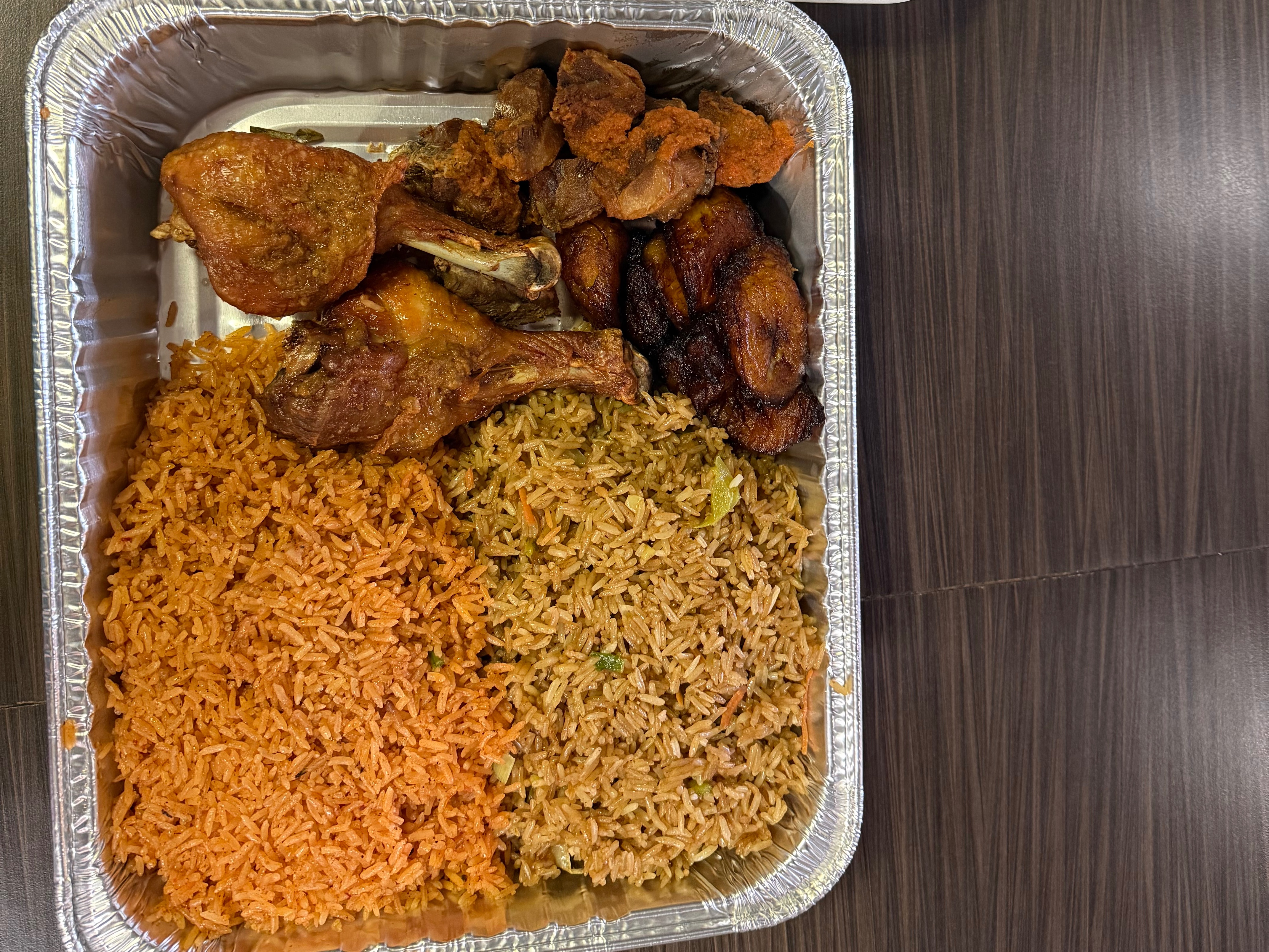 Platter Jollof ,fried Rice,chofi,chicken,plantains.