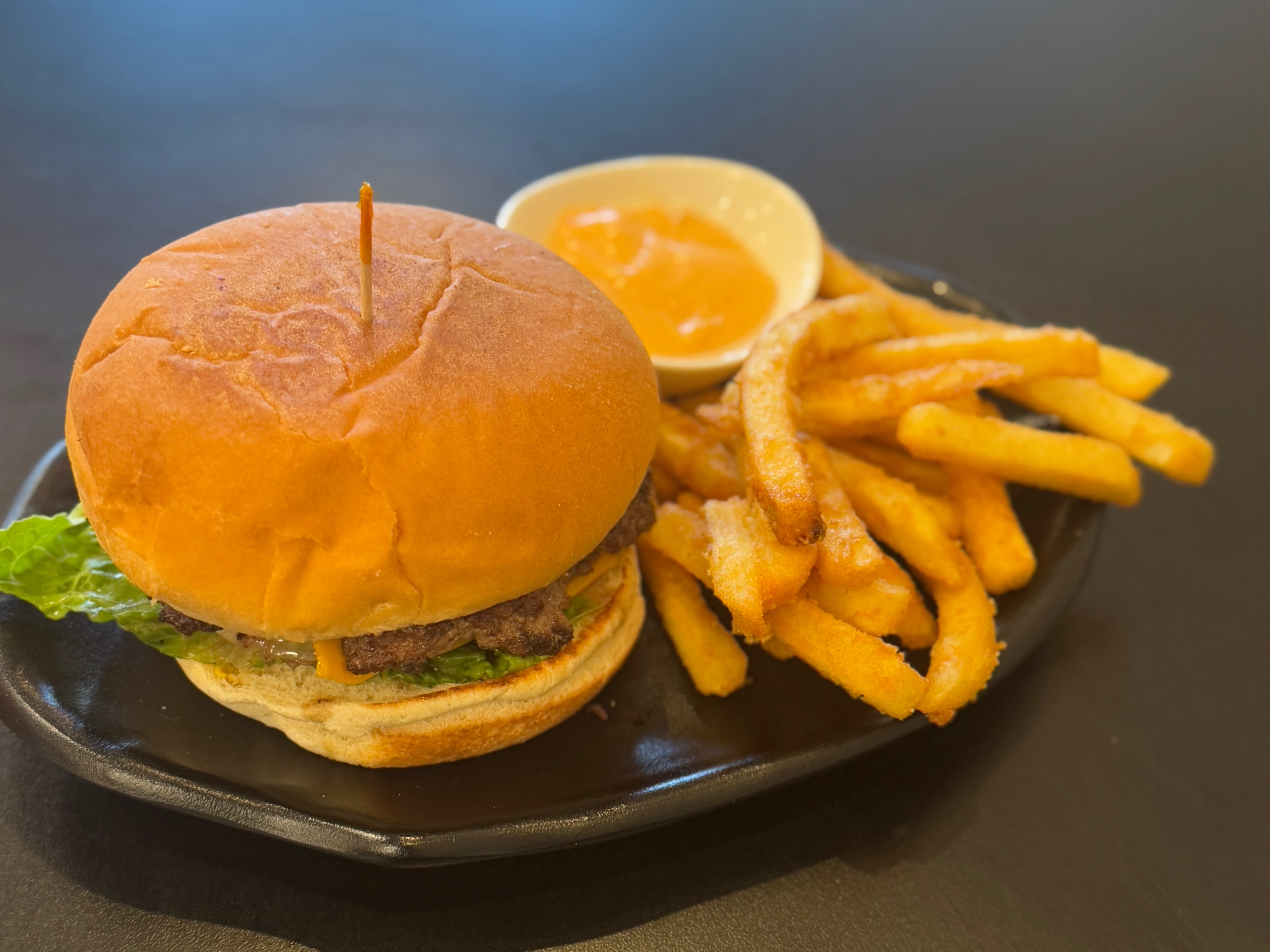 Lamb Kabab Burger (Lettuce,Tomato,sauted Onion,Cheese,Sharjah Sauce) Small Fries.