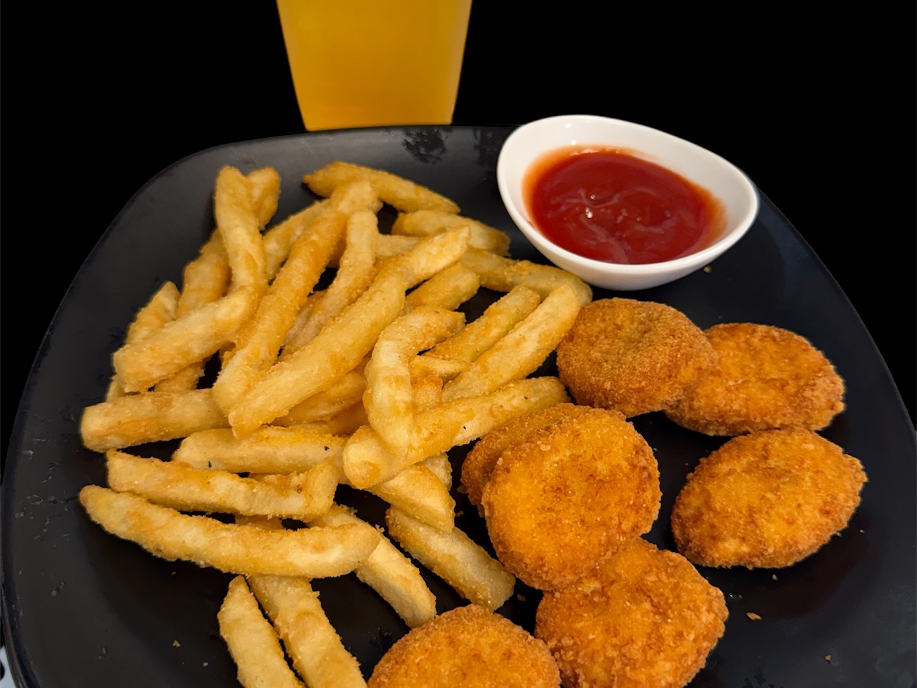 6 Pices Of Chicken Nuggets, Fries, Corn, Apple Or Orange Juice.