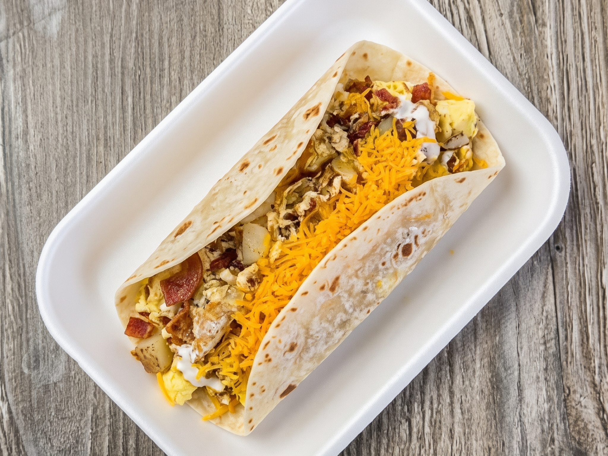 Bacon, Eggs, Papas, Cheese Burrito