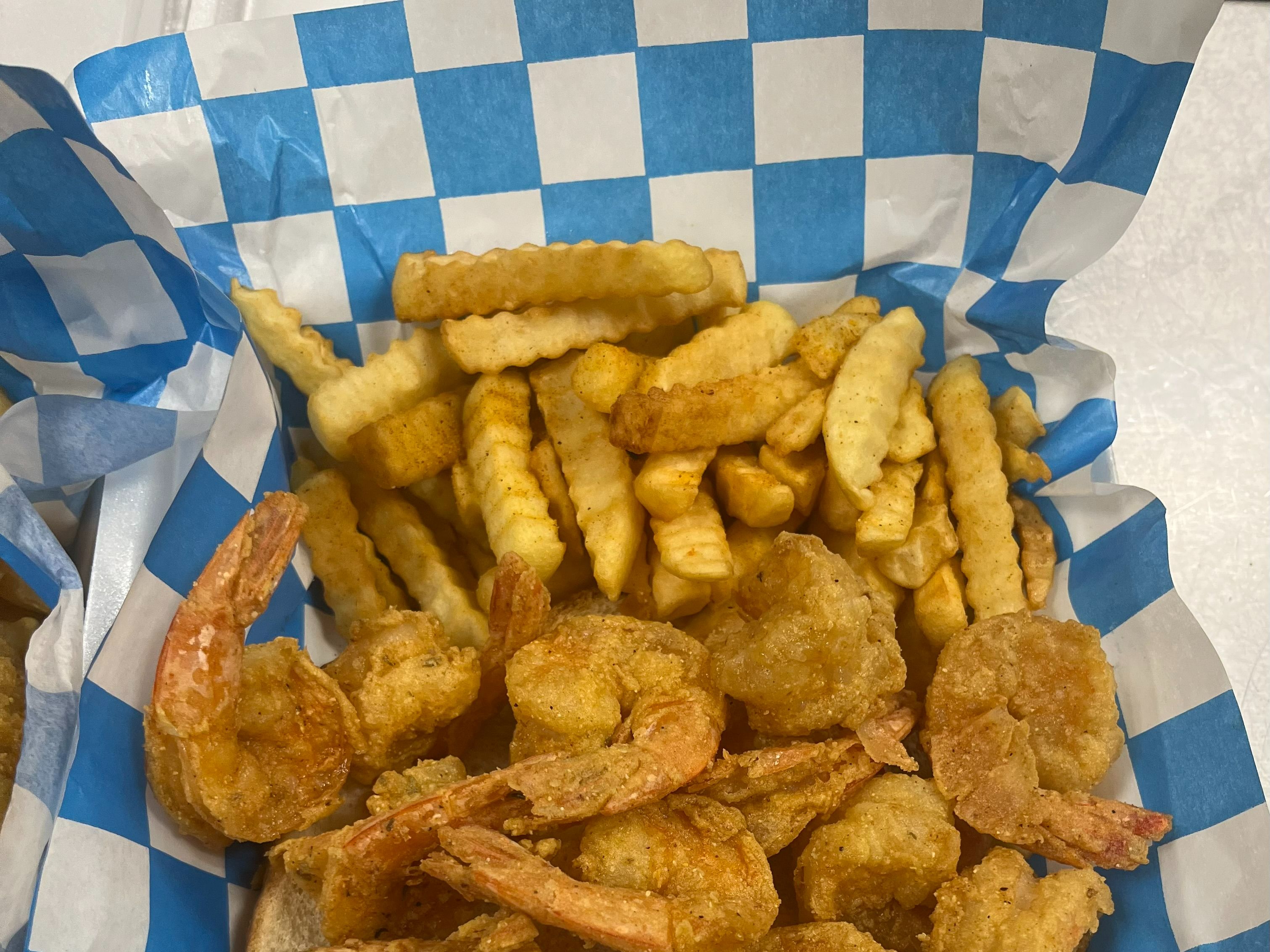 12 Piece Fried Jumbo Shrimp Dinner with 4 Hushpuppies with Fries.