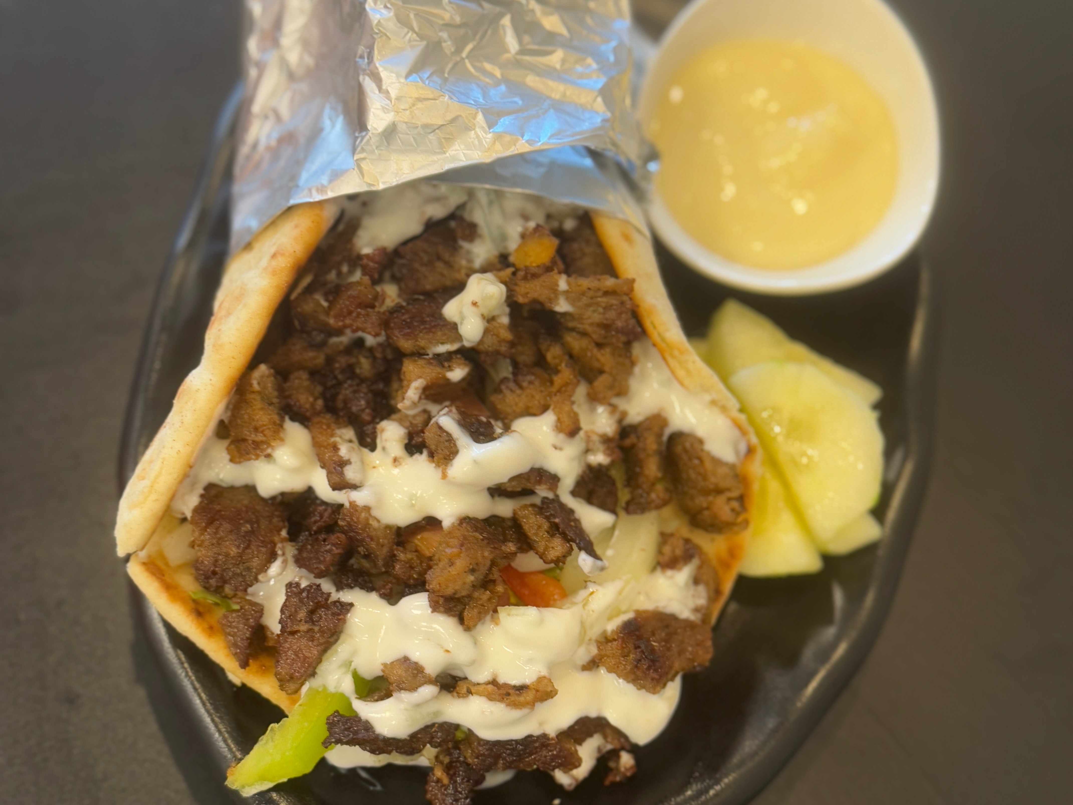 Mixed Grill Gyro Wrap ( Beef&chicken,Lettuce,Tomato,,onion,pepper,sharjahTzatziki Sauce)