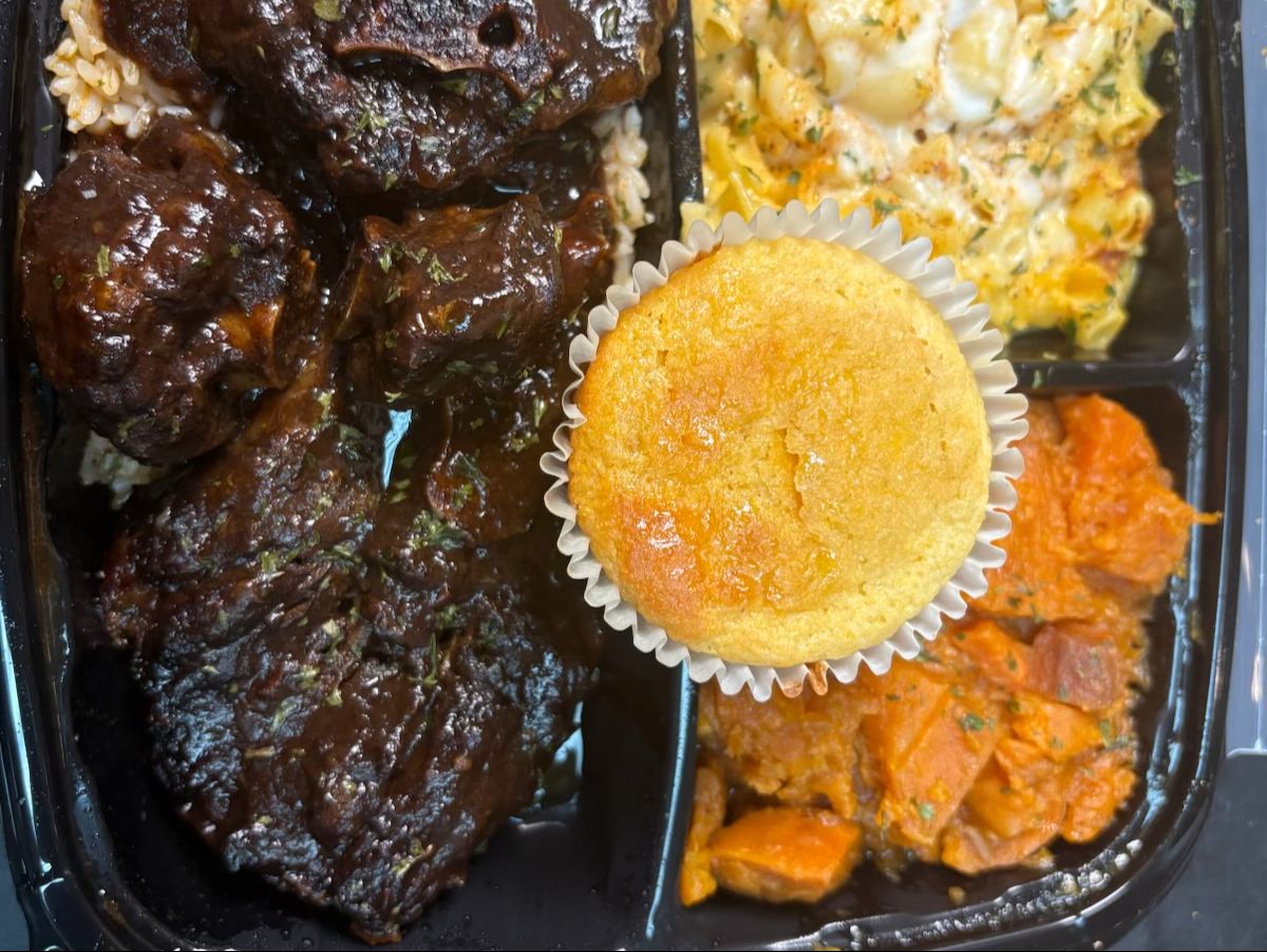 Oxtail Plate Served with Yams Mac N' Cheese and Cornbread.