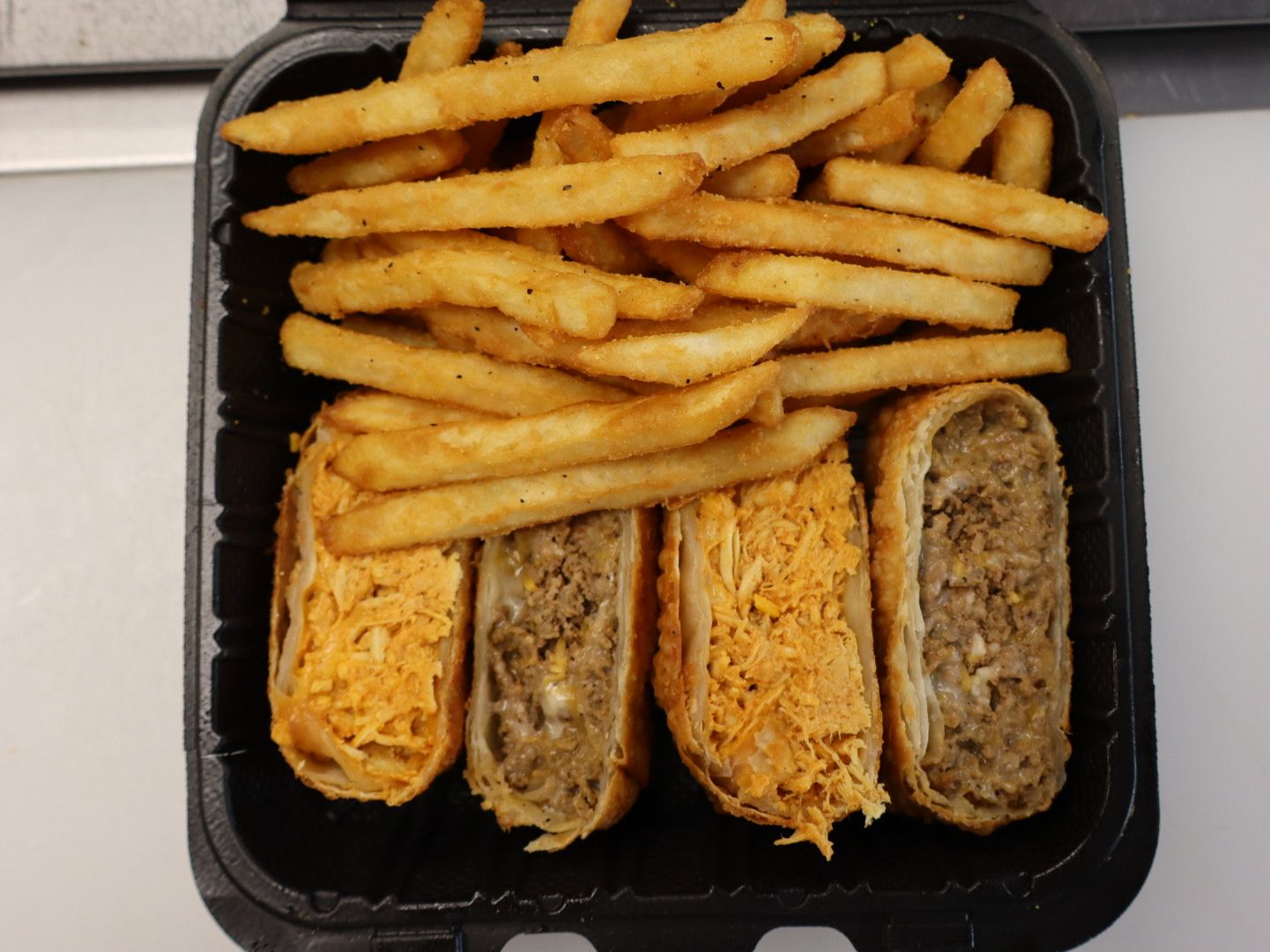 Half Buffalo Chicken & Half Cheesesteak W/Fries.