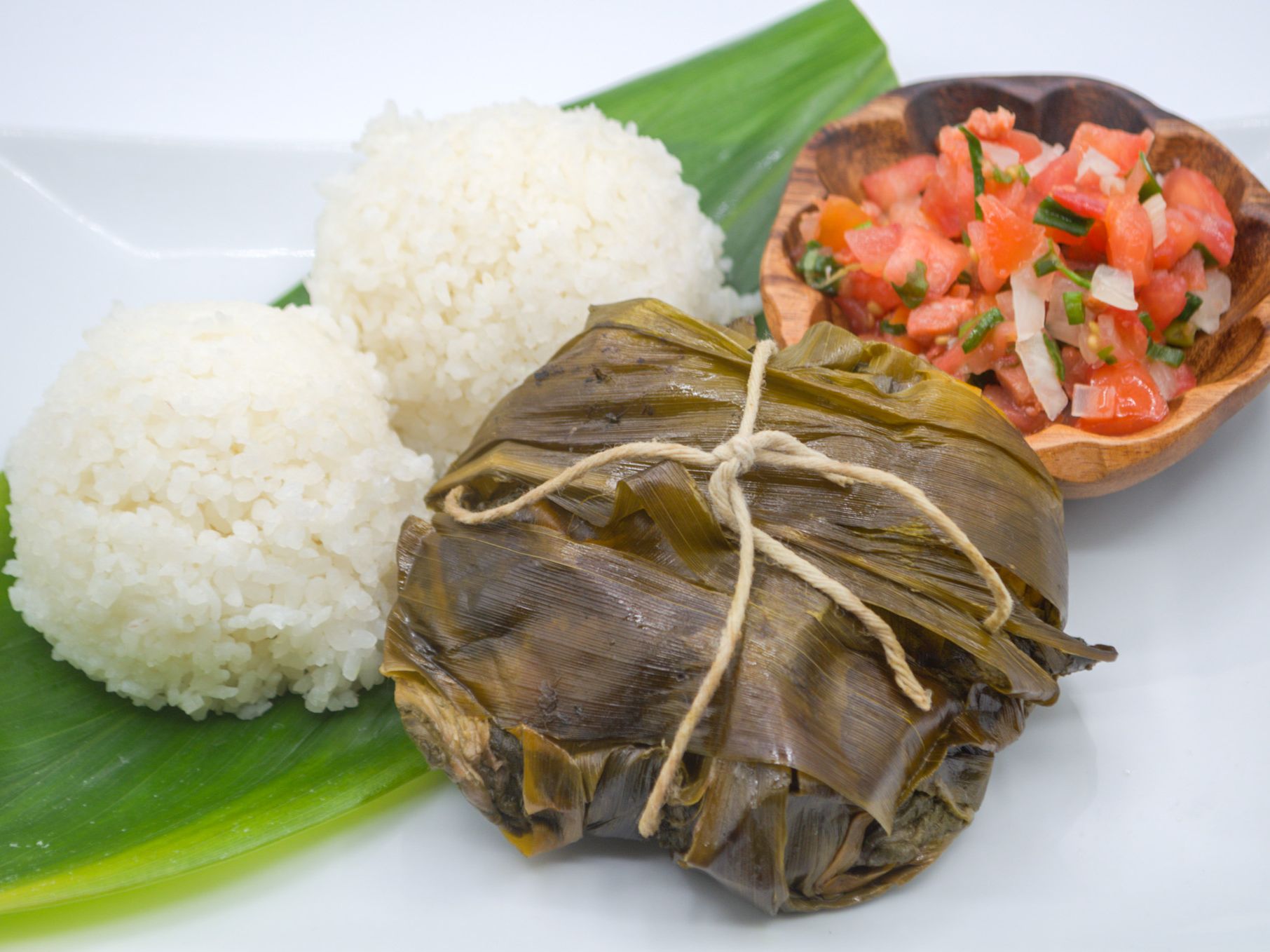 #2 Lau Lau & Lomi Salmon from Yama's Fish Market — Our signature lau lau paired with freshly made lomi salmon — salted salmon mixed with tomato and onion, served chilled — alongside white rice.