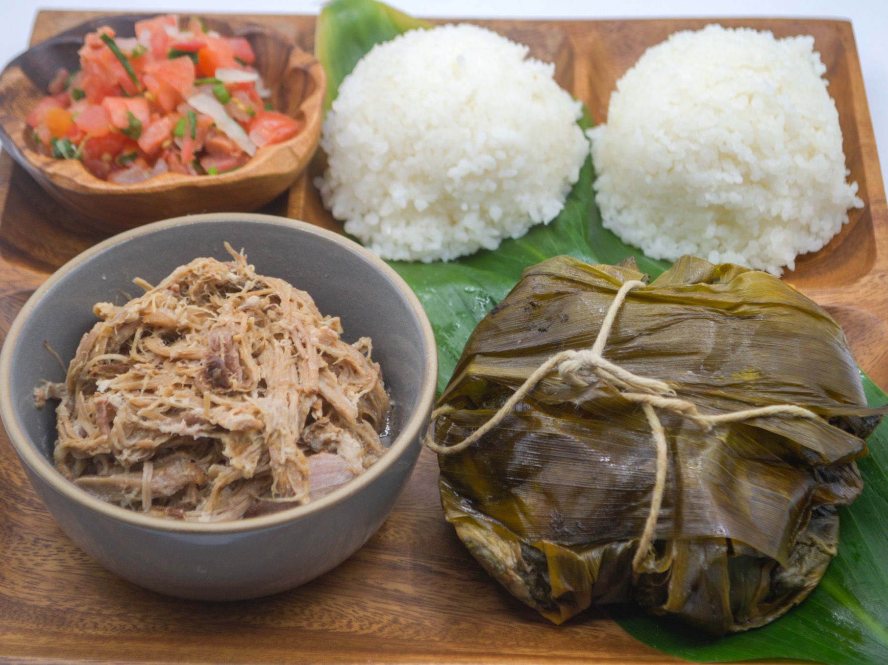 #7 Lau Lau, Kalua Pig & Lomi from Yama's Fish Market — A Hawaiian feast — our signature lau lau, smoky kalua pig, and lomi salmon with white rice.