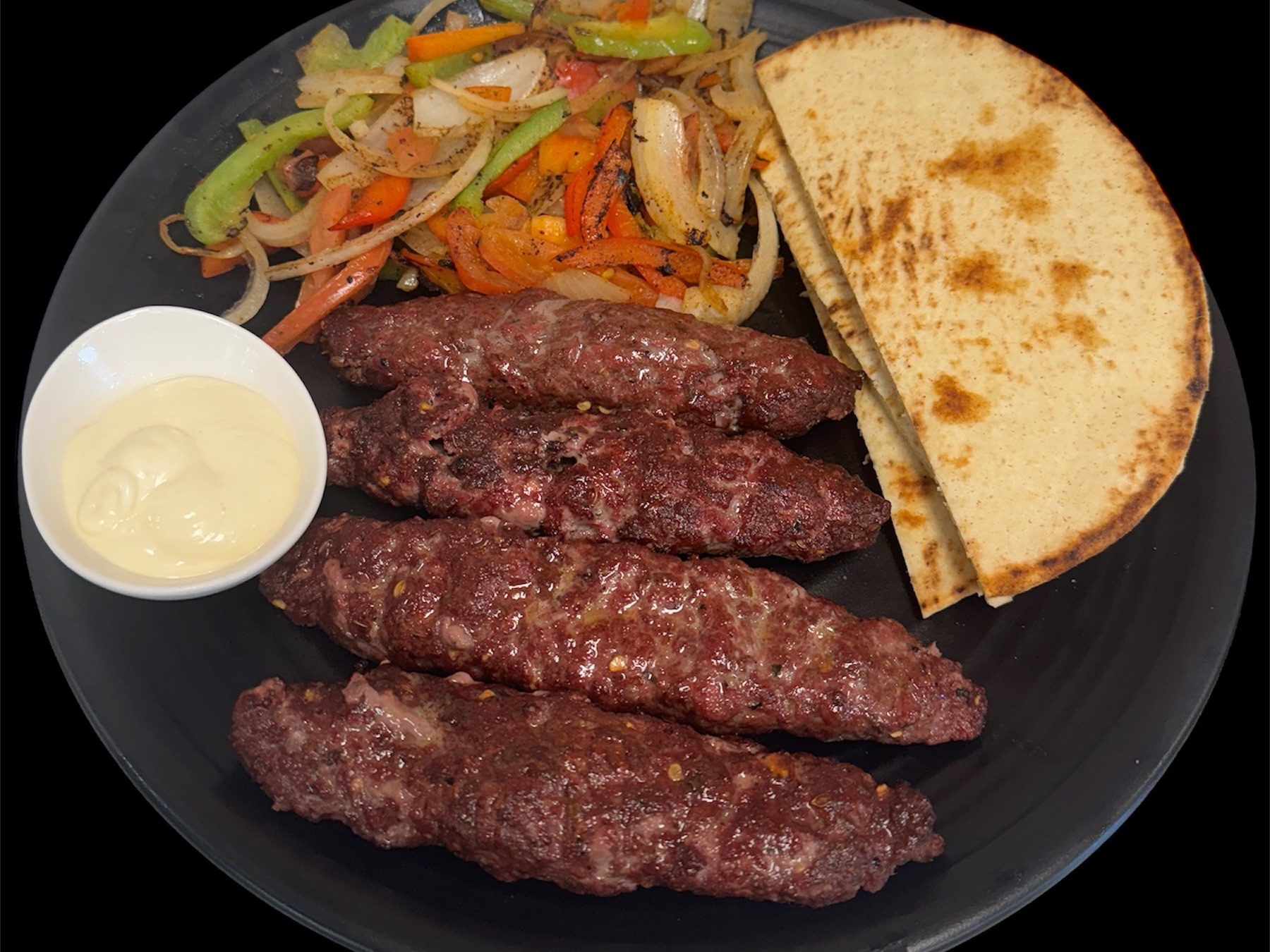 Lamb Kabab With Pita Bread ( 4 Pice Lamb Seekh Kabab, Two Pita Bread, Salad, Garlic Dip).