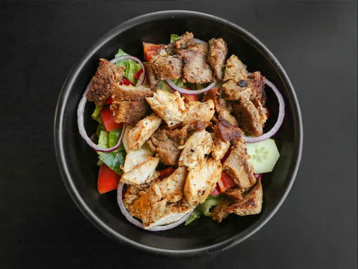 Sharjah House Special Salad ( Chicken& Beef,lettuce,Tomato,cucumber,onion,pepper,sharjah Dressing).