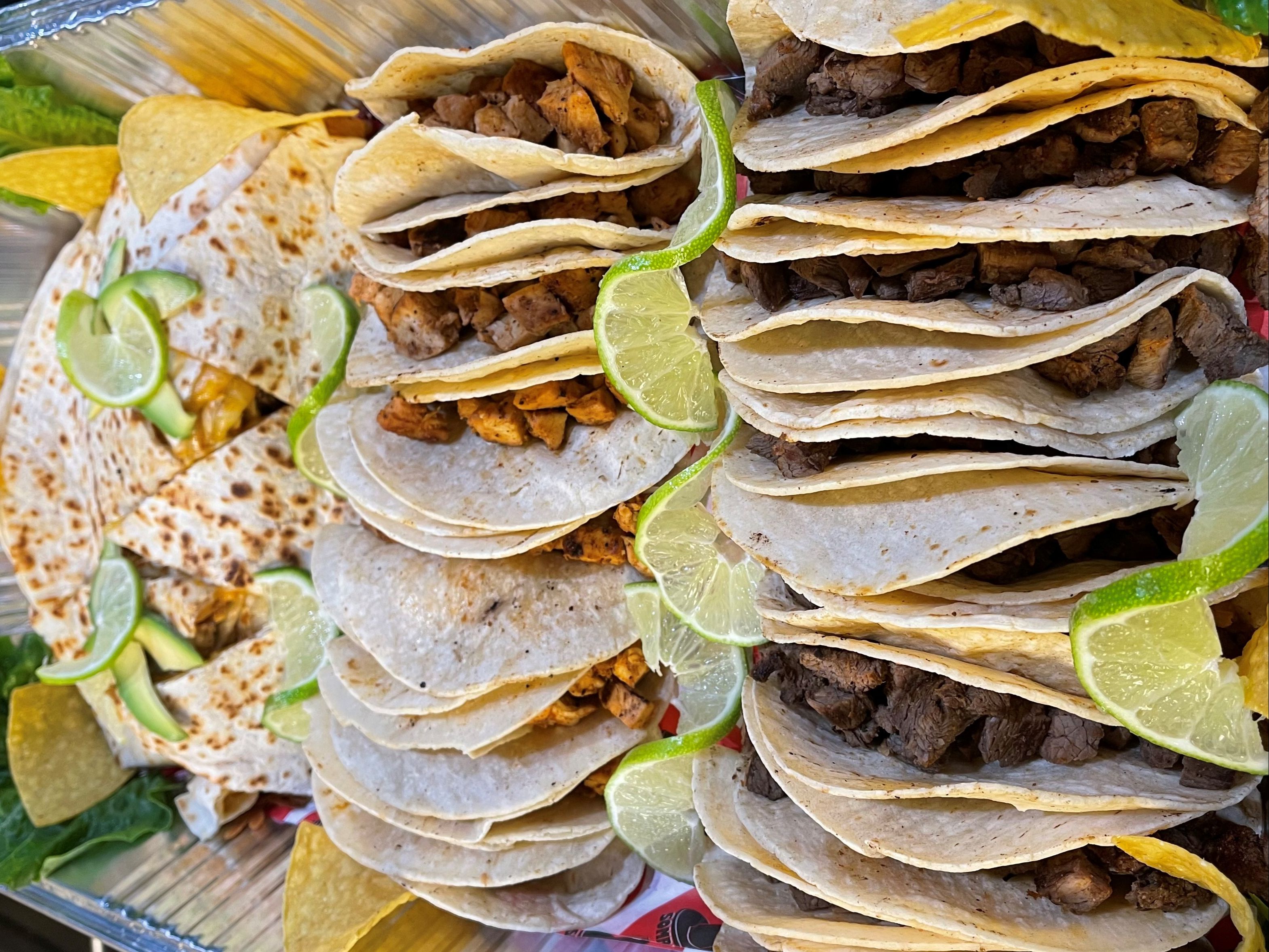 Familia Platter (10 Chicken, 10 Steak Tacos, 3 Quesadillas (Chicken, Steak & Cheese) Sides of Rice and Beans, Chips and Guac).