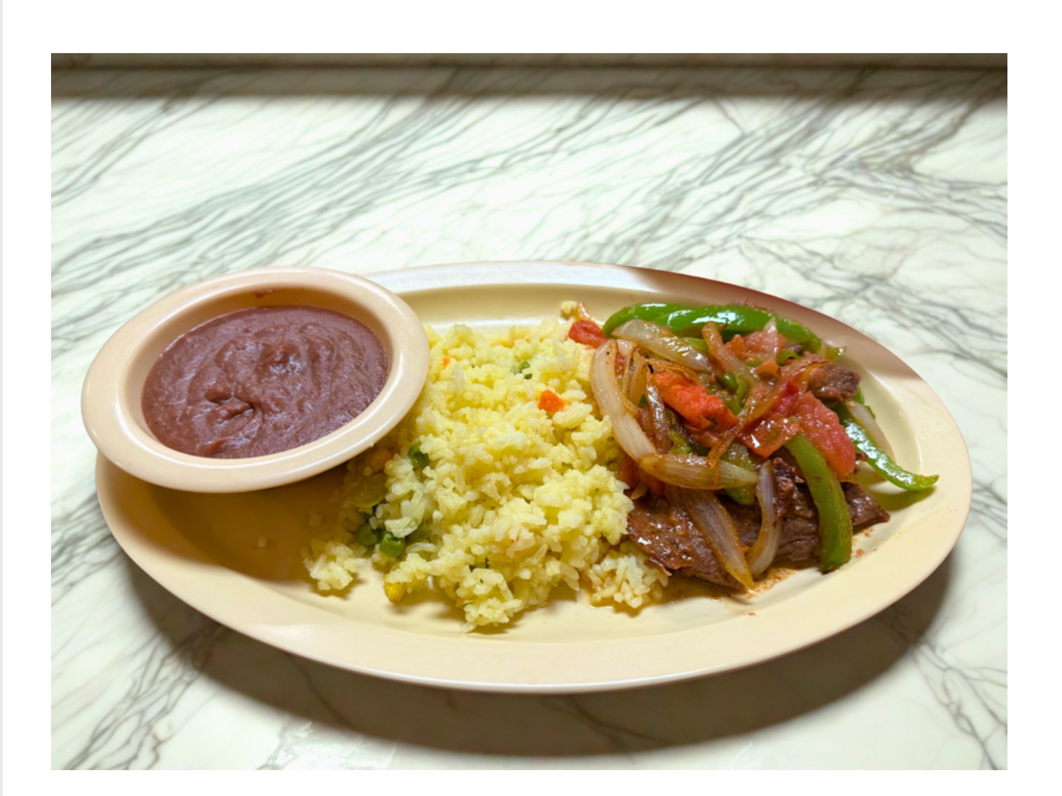 Bistec Encebollado.
