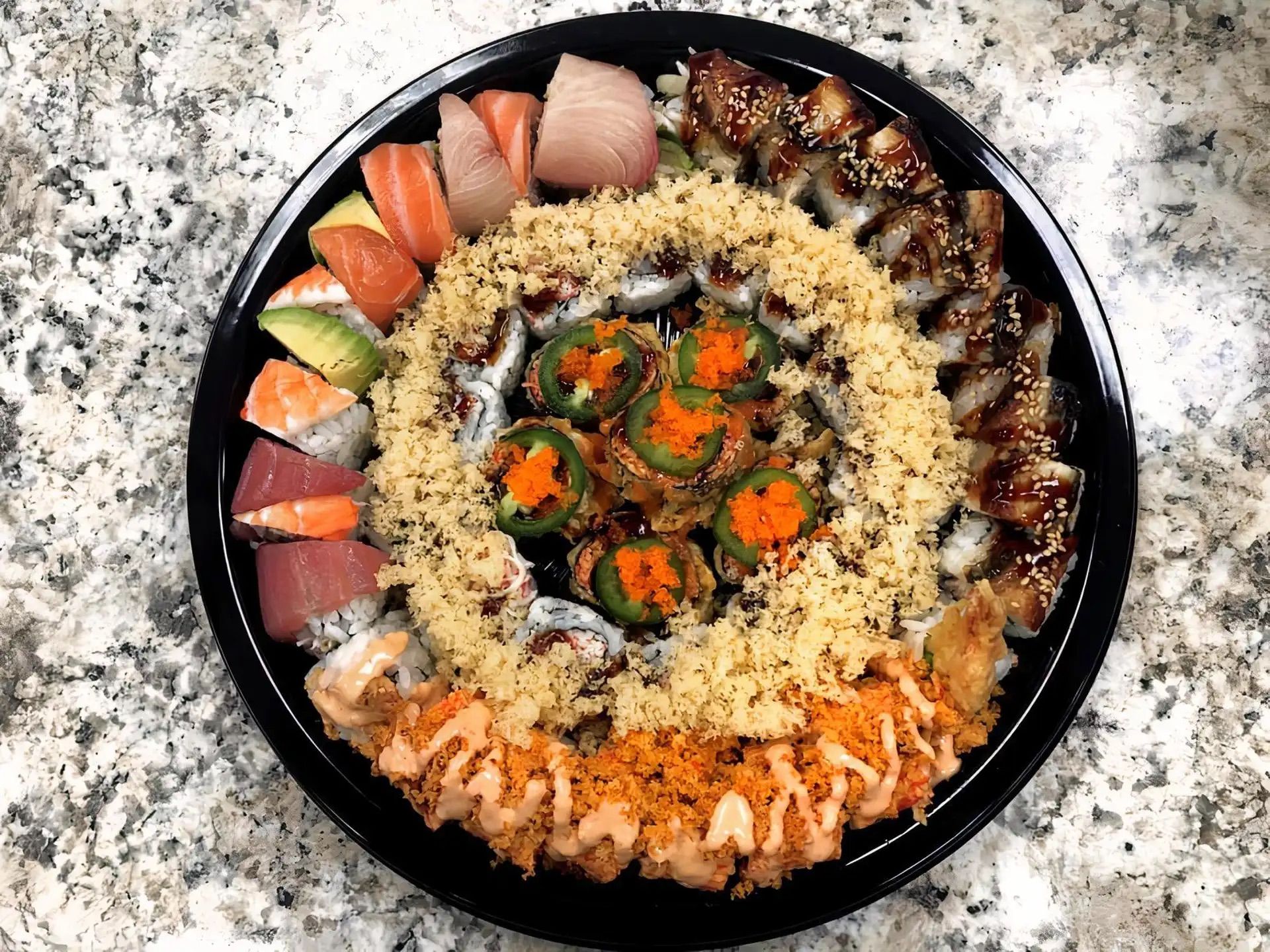 P4 (2 Crab Crunch Rolls, 1 Volcano Roll, 1 Rainbow Roll, 1 Dragon Roll, 1 Spicy Crab Crunch Roll).