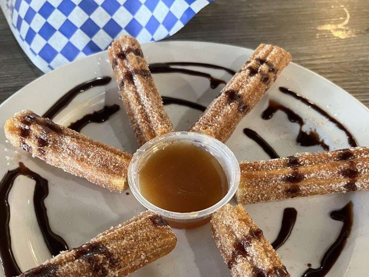 2 Churros with Caramel & Chocolate.