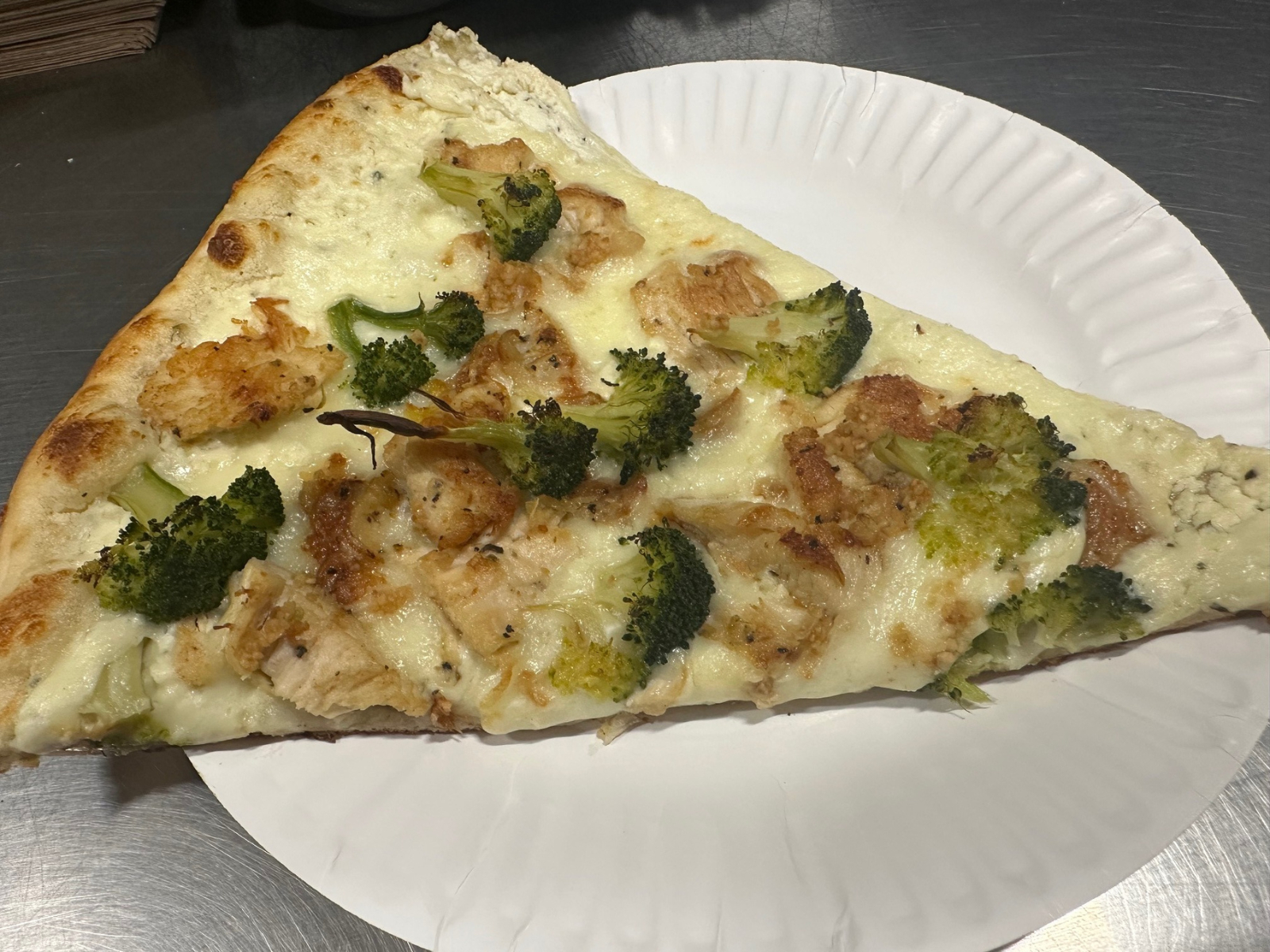 Pizza Slice: White Chicken & Broccoli.