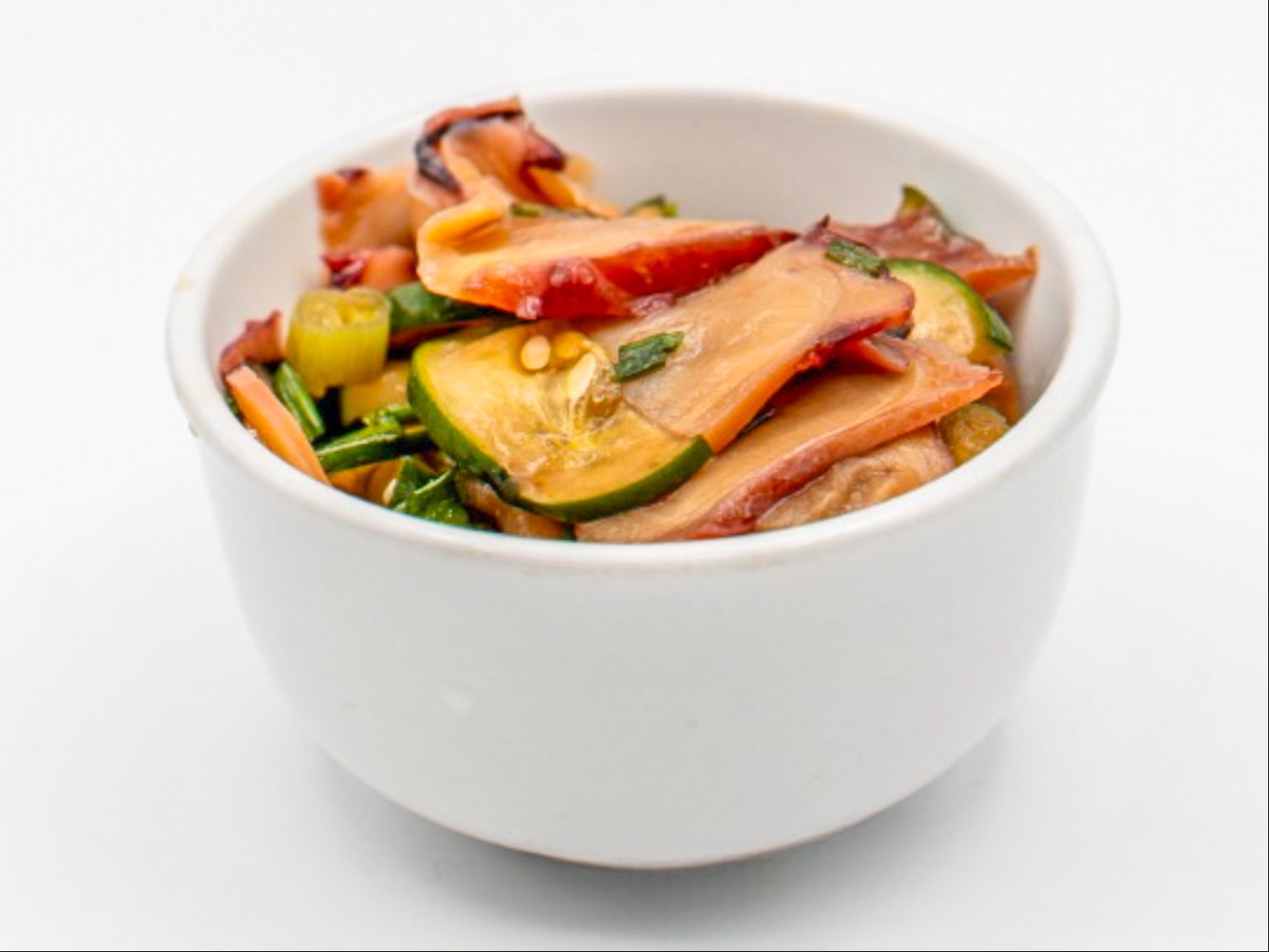 Shoyu Tako Poke from Yama's Fish Market — Thinly cut tako, sliced round onions, green onions with Yama's special sauce. Click for available sizes/pricing