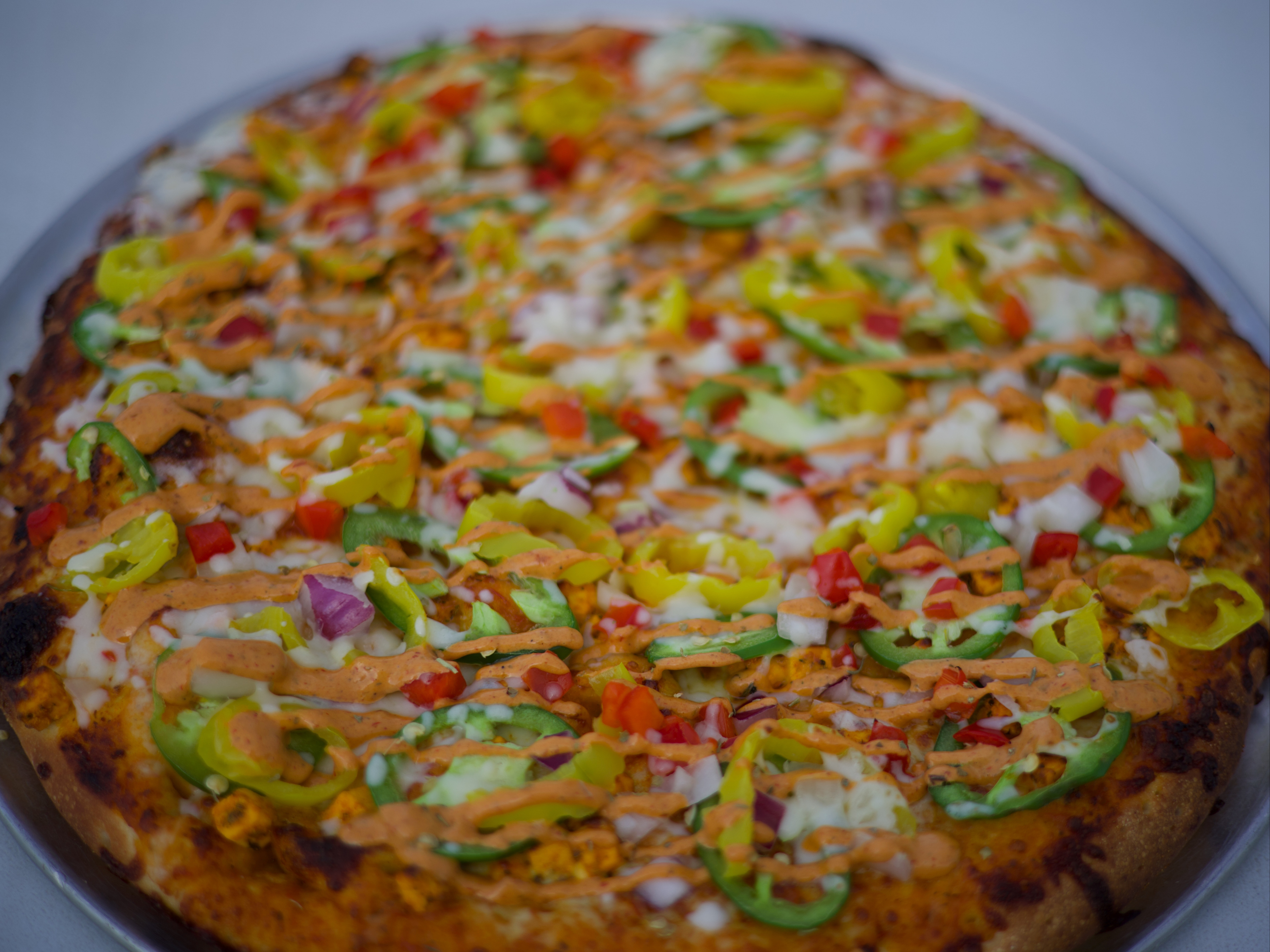 AK-47 Paneer/chicken Pizza.